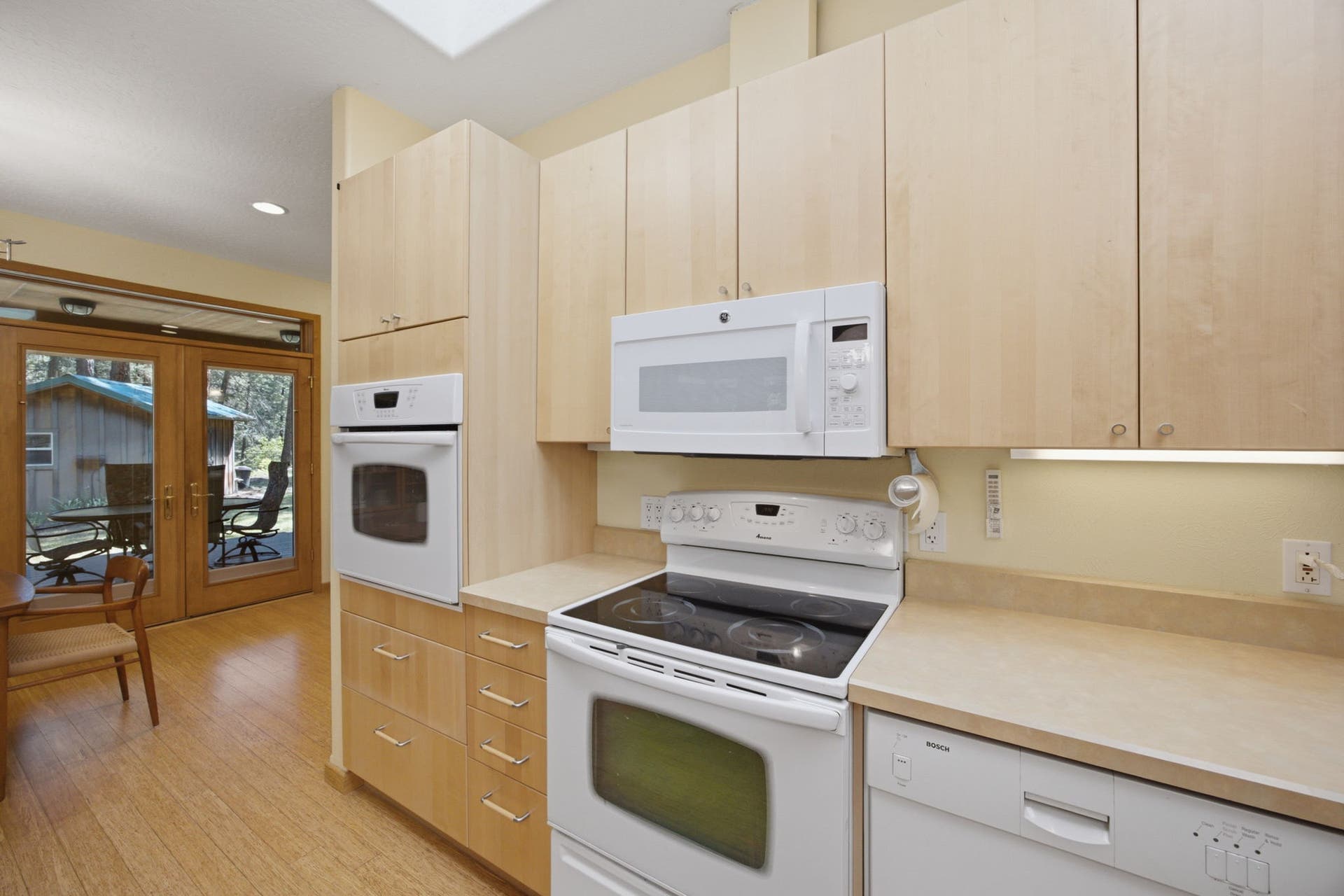 Extensive cabinetry, generous prep space, and quality finishes make this kitchen as practical as it is inviting, with an efficient layout designed for daily living.