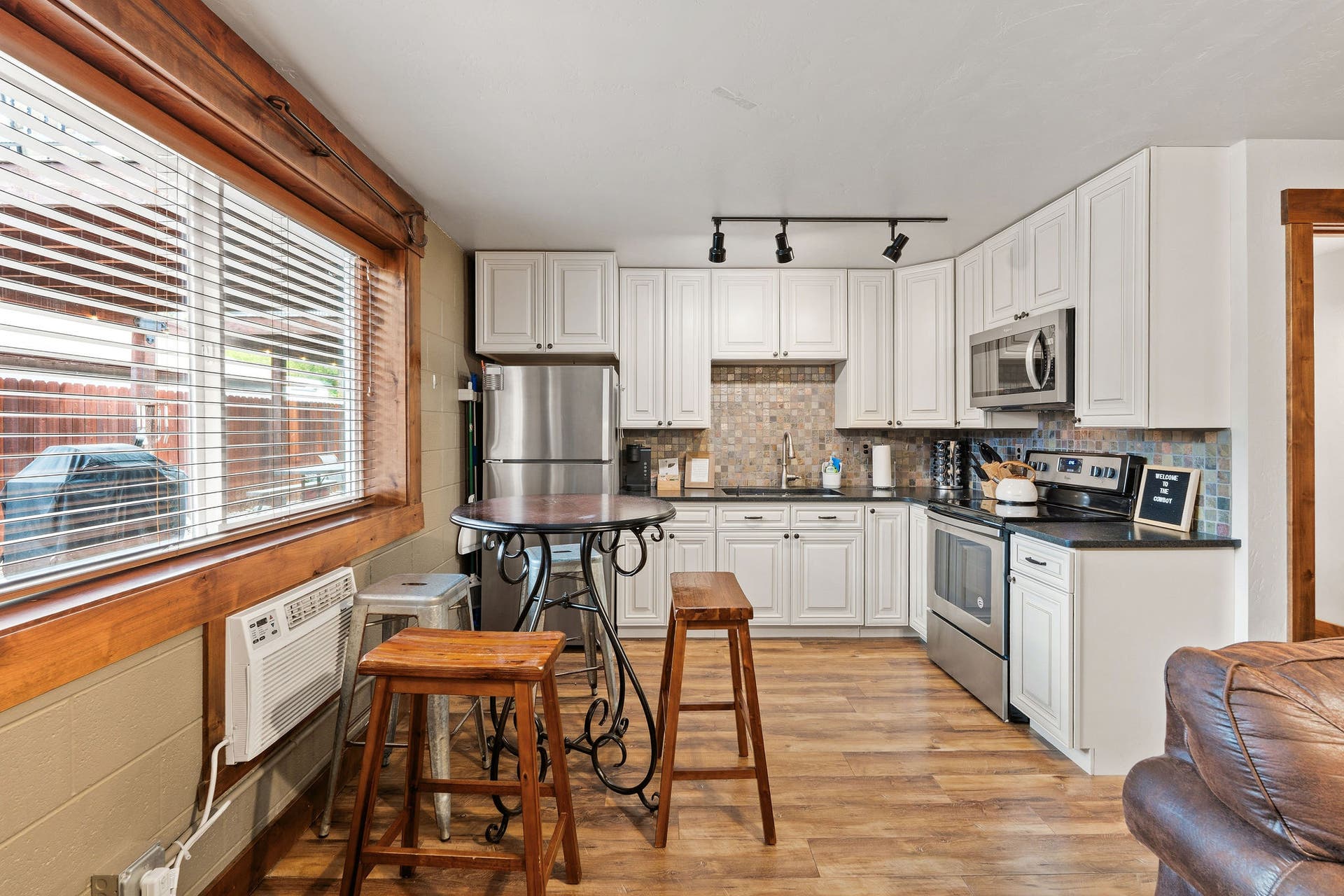 473 Osborn Avenue, Bigfork, MT 59911 The Cowboy: Full Kitchen and dining area. Full-size fridge, Oven/stove, and dinning area