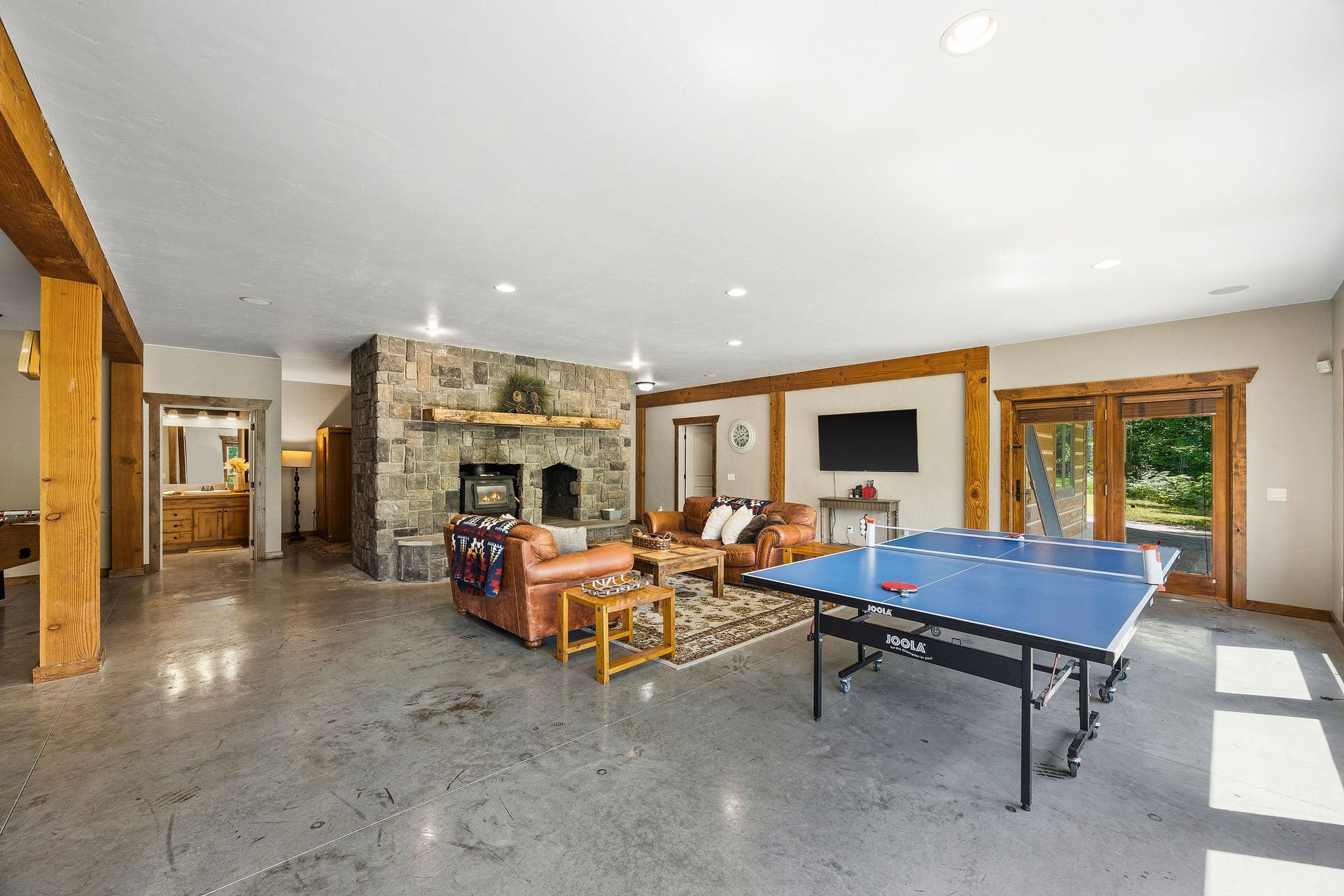 70 Big Cedar, Bigfork, MT 59911 Lower level play room with fireplace
