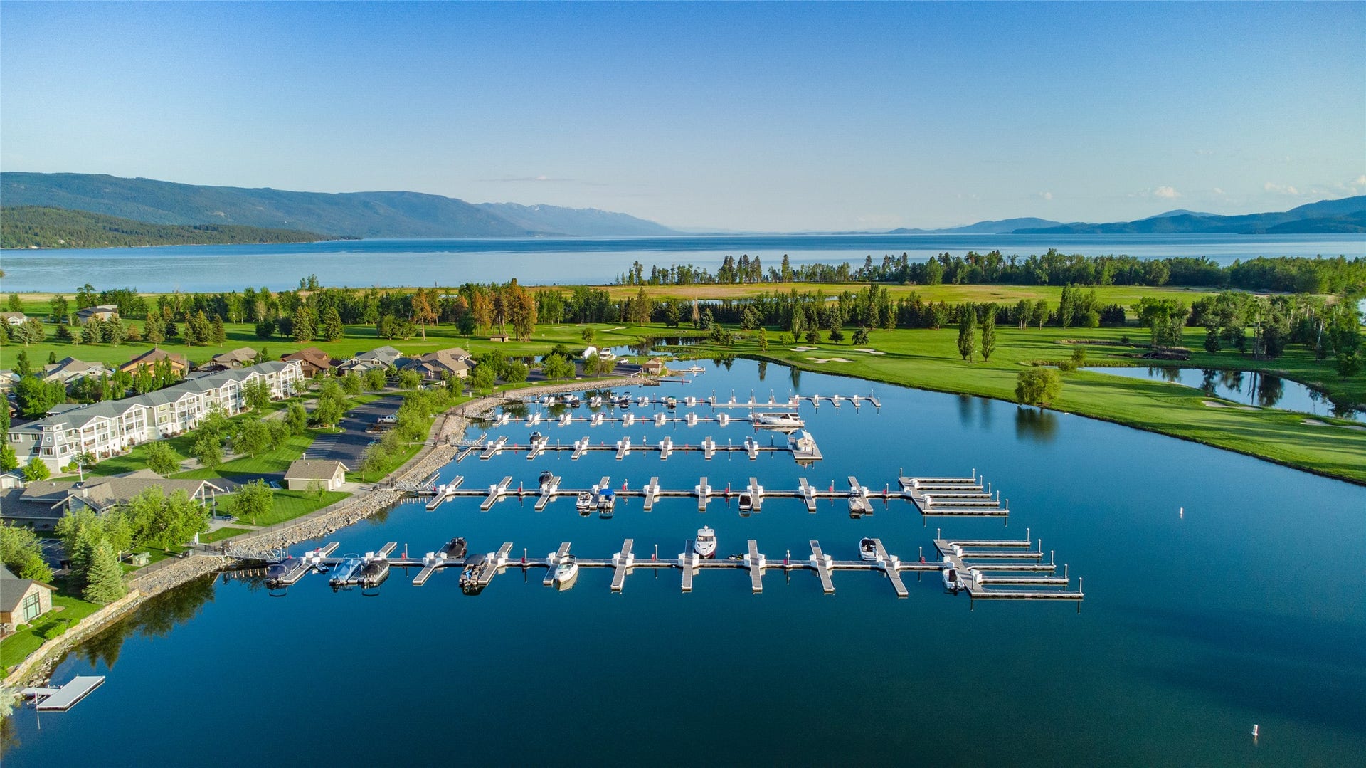 C12 Eagle Bend Yacht Harbor, Bigfork, MT 59911 Aerial view featuring a water and mountain view