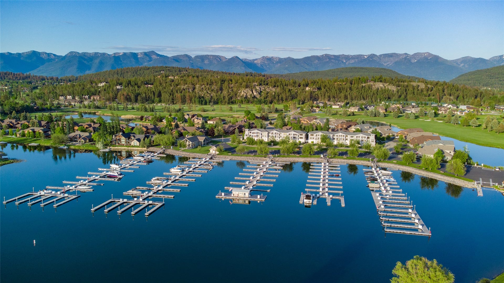 C12 Eagle Bend Yacht Harbor, Bigfork, MT 59911 Aerial view featuring a water and mountain view and a wooded view