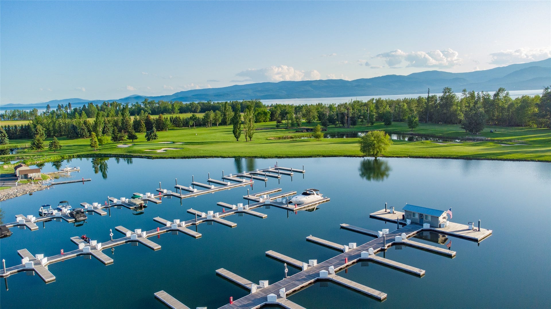 C12 Eagle Bend Yacht Harbor, Bigfork, MT 59911 Aerial view featuring a water and mountain view