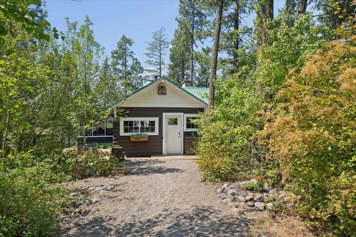332 Flathead Lodge Road, Bigfork, MT 59911 Main cabin with Flathead Lake beyond