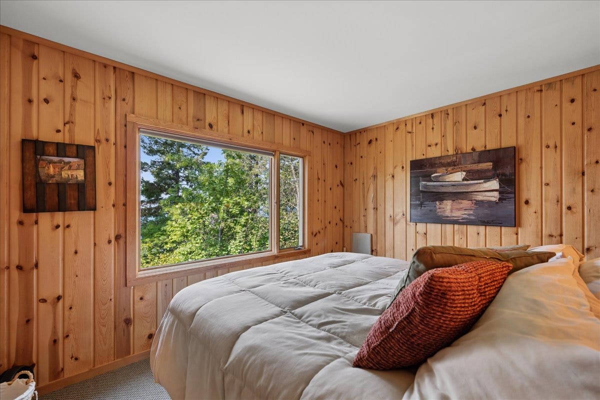 332 Flathead Lodge Road, Bigfork, MT 59911 master bedroom with views facing the lake