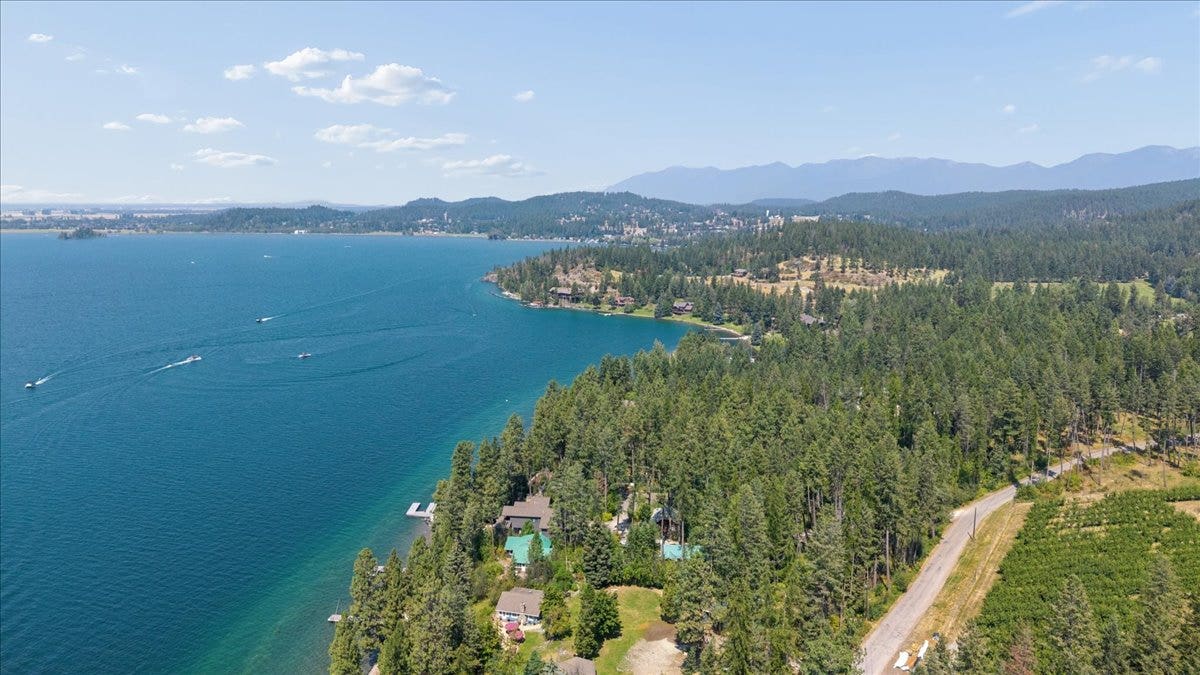 332 Flathead Lodge Road, Bigfork, MT 59911 Cabin with green roof. Located just south of the beautiful village of Bigfork!
