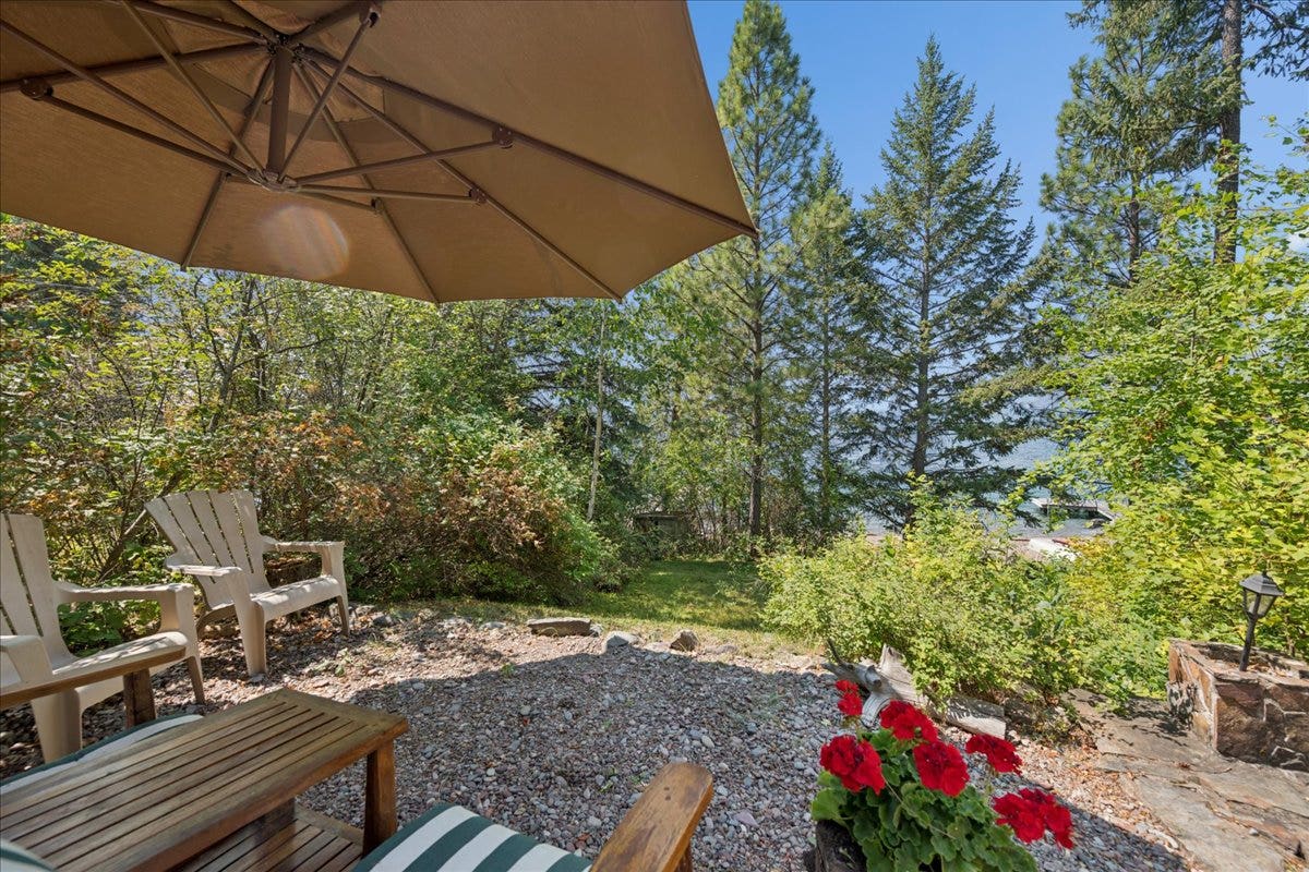 332 Flathead Lodge Road, Bigfork, MT 59911 Outdoor patio area with path leading to the lake