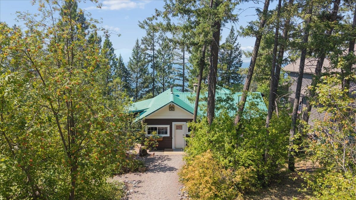 332 Flathead Lodge Road, Bigfork, MT 59911 Looking east toward main cabin and lake