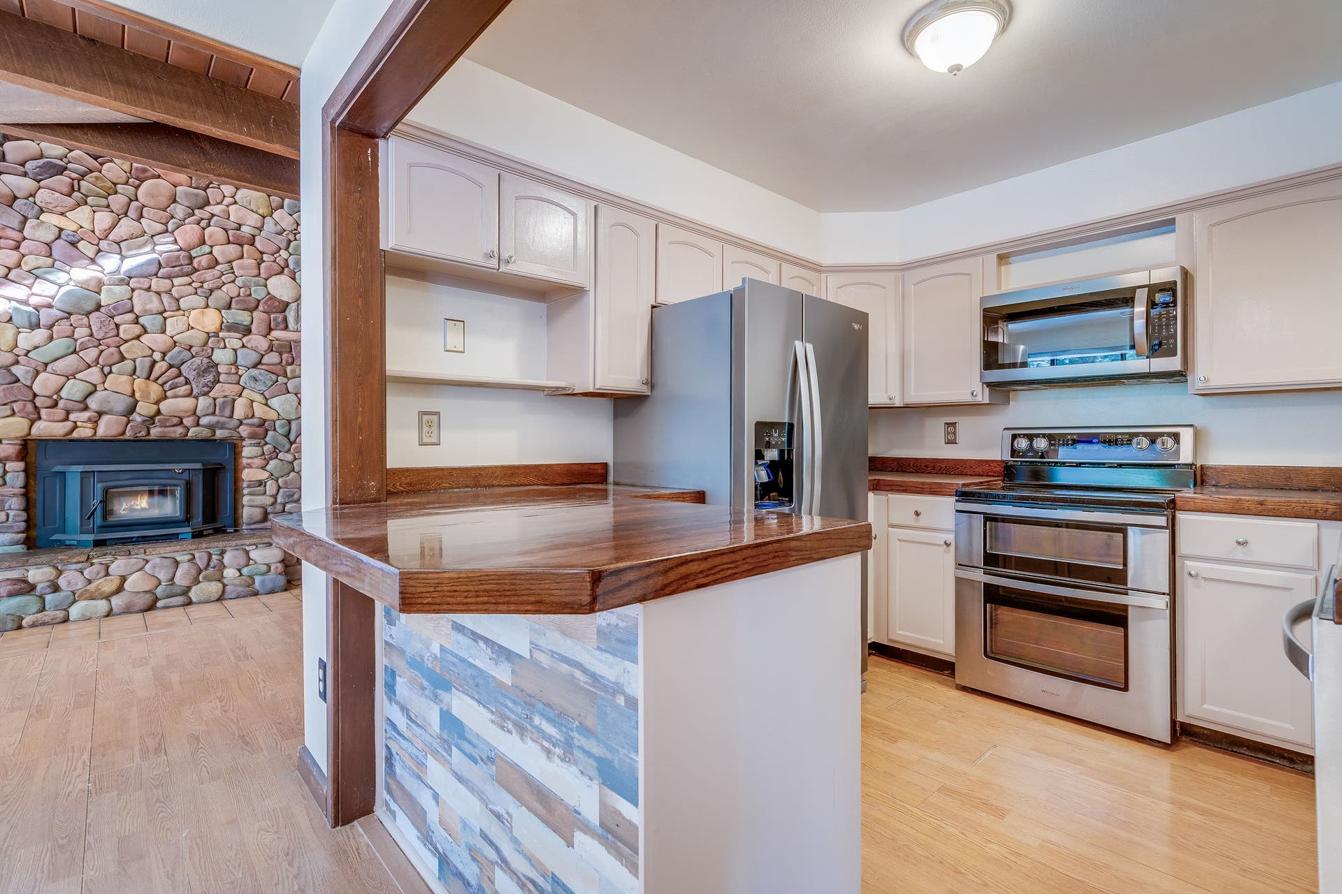 244 Bench Drive, Kalispell, MT 59901 Functional kitchen and dining space featuring solid 1980s build quality and warm wood accents throughout.