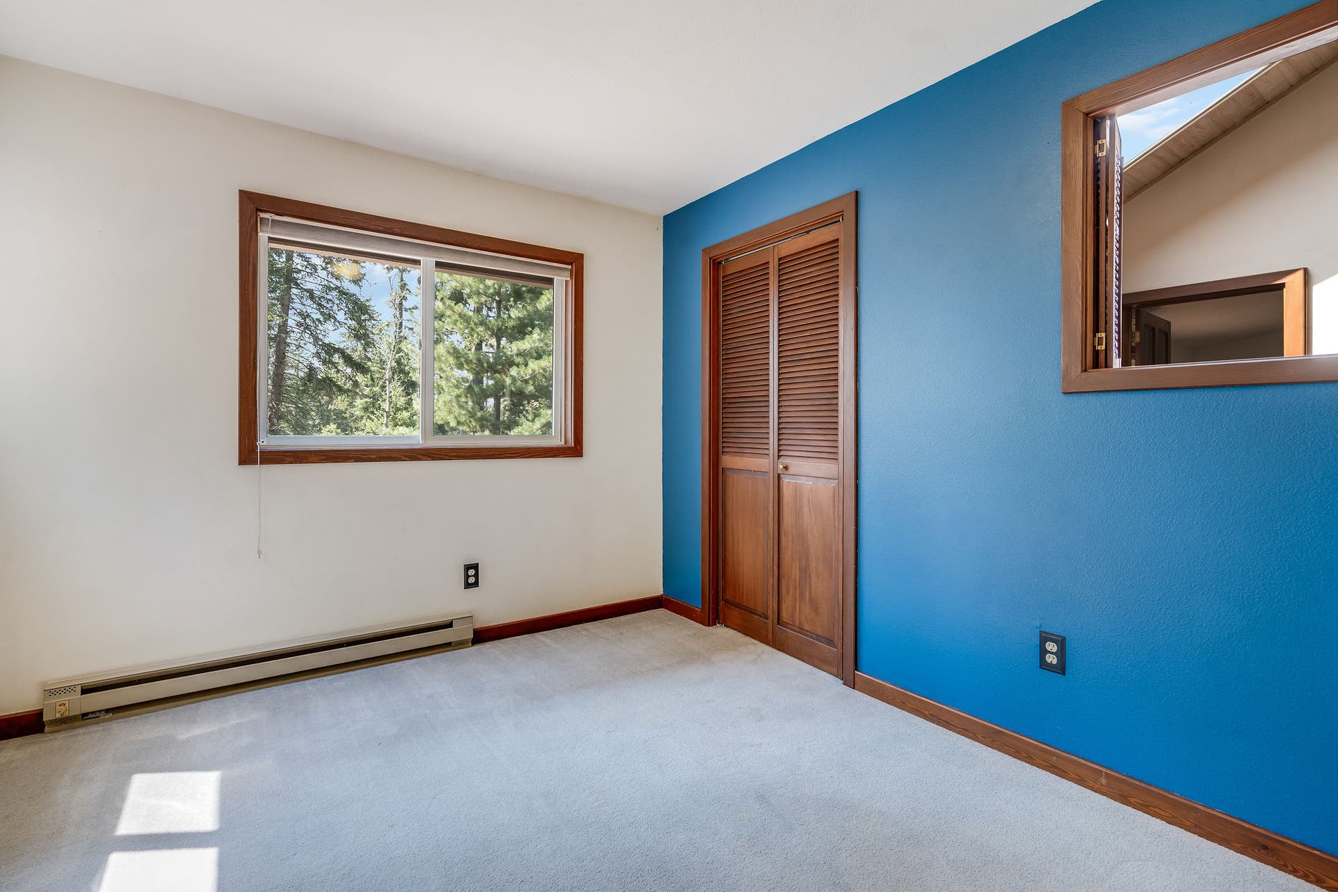 244 Bench Drive, Kalispell, MT 59901 Bright and comfortable guest bedroom offering great natural light and traditional charm.