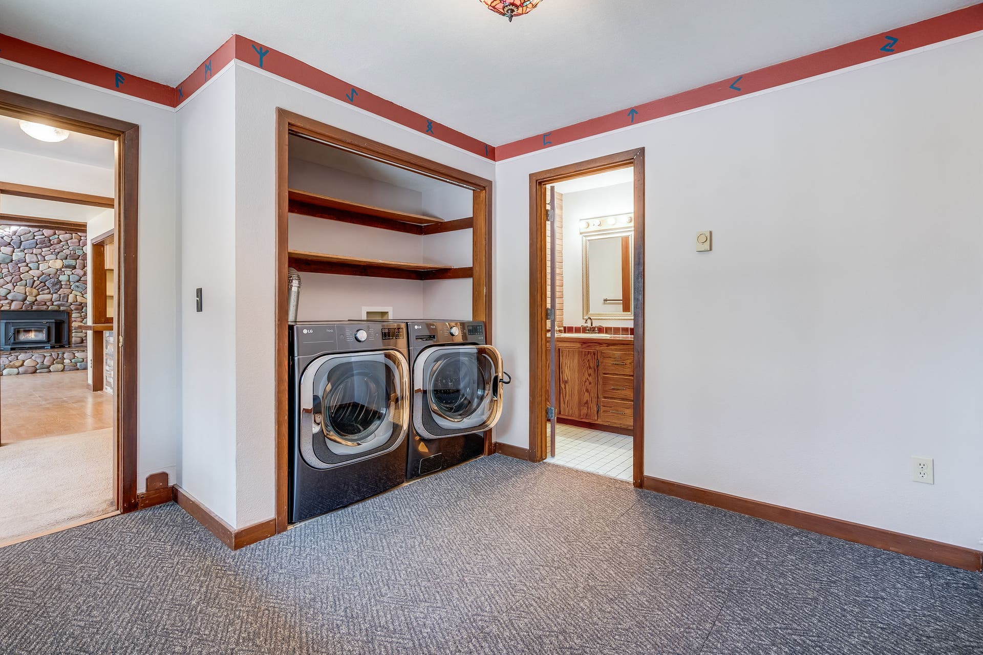 244 Bench Drive, Kalispell, MT 59901 Oversized laundry room and mudroom with attached full bathroom for convenient access.