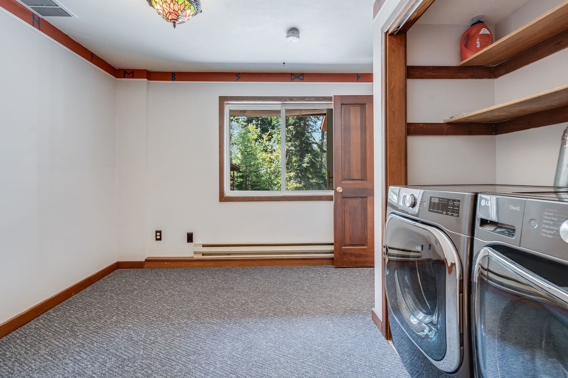 244 Bench Drive, Kalispell, MT 59901 Oversized laundry room and mudroom with extra storage space in Kalispell Montana home.