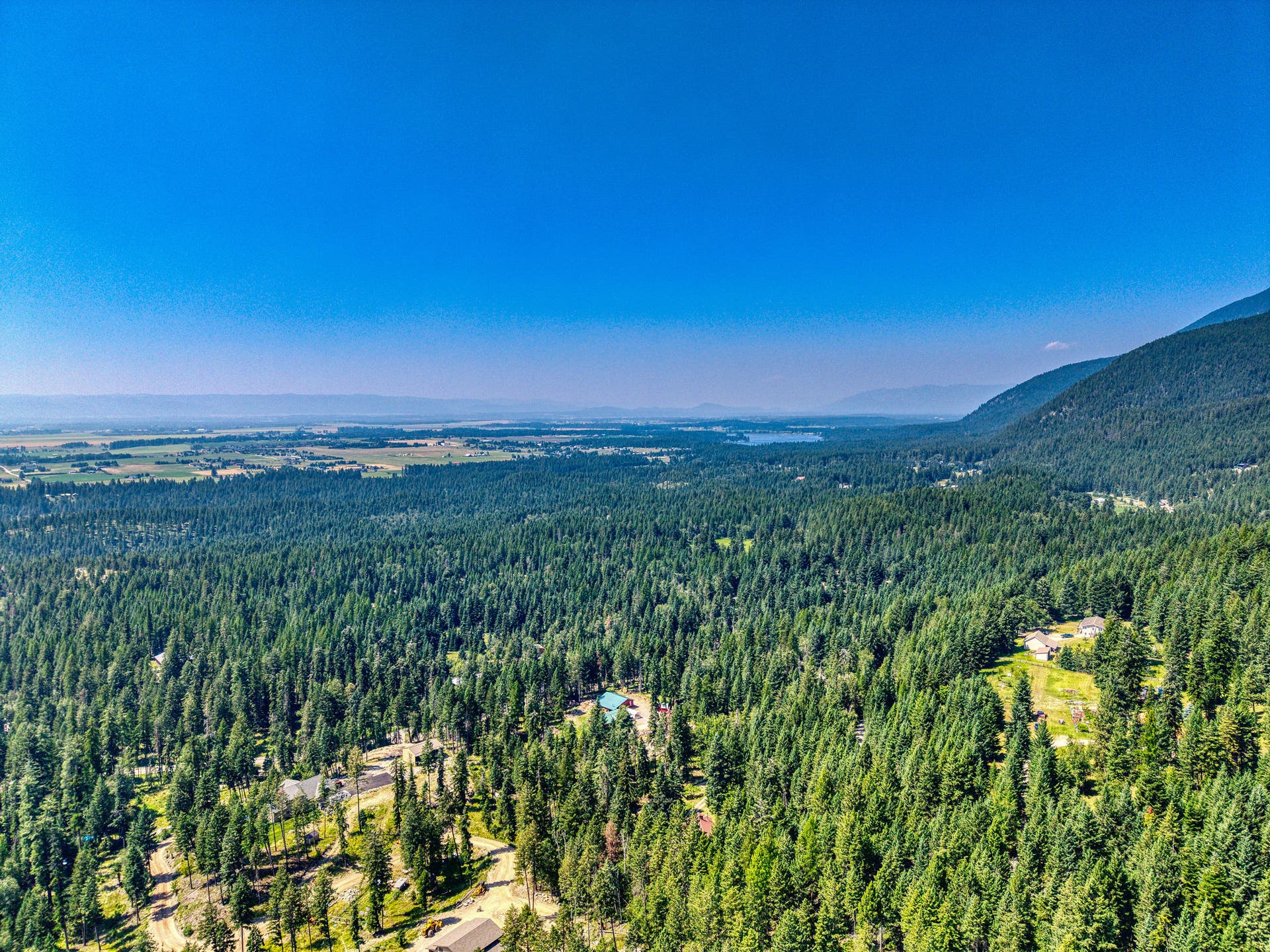 244 Bench Drive, Kalispell, MT 59901 Aerial drone shot of 244 Bench Run home on 3 acres near Flathead Lake and Bigfork MT. Wooded privacy just minutes from Flathead Lake, Bigfork, and world-class hiking in the Jewel Basin.
