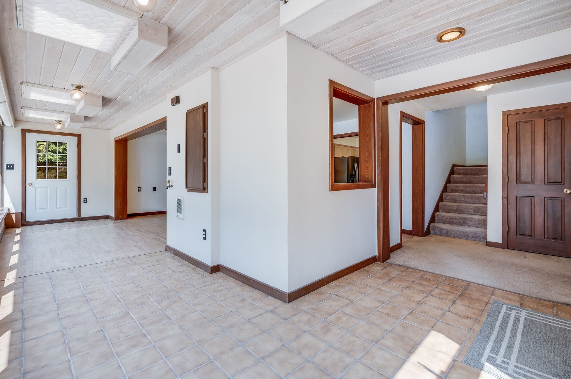 244 Bench Drive, Kalispell, MT 59901 Sunroom entry and stairs to upper level in this Kalispell Montana home.