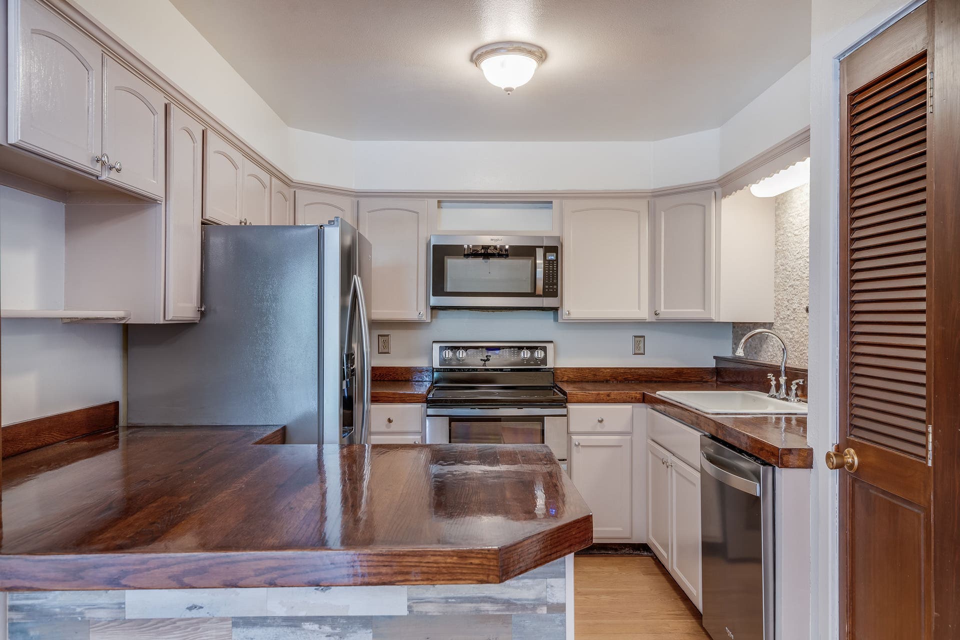 244 Bench Drive, Kalispell, MT 59901 Functional kitchen and dining space featuring solid 1980s build quality and warm wood accents throughout.