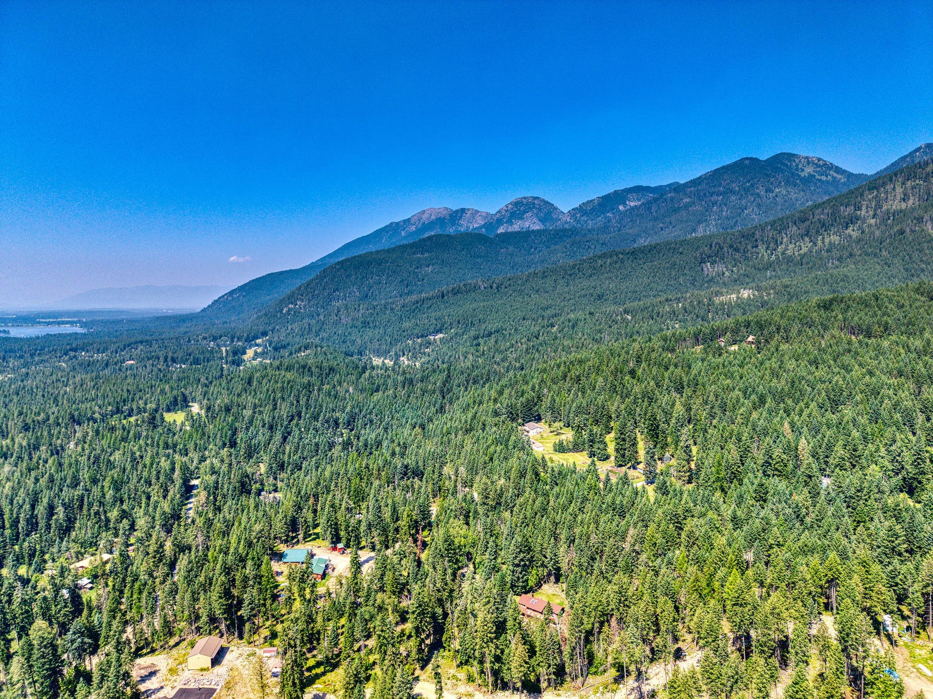 244 Bench Drive, Kalispell, MT 59901 Aerial drone shot of 244 Bench Run home on 3 acres near Flathead Lake and Bigfork MT. Wooded privacy just minutes from Flathead Lake, Bigfork, and world-class hiking in the Jewel Basin.
