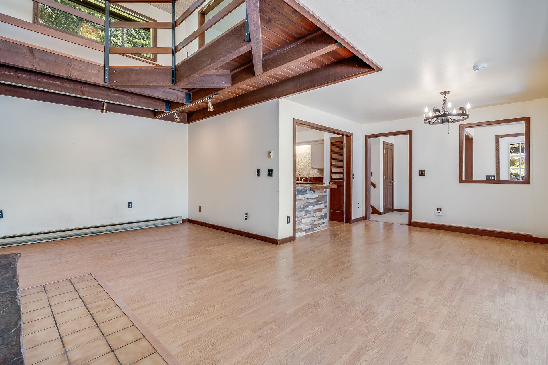 244 Bench Drive, Kalispell, MT 59901 Spacious living / dining room featuring a rock surround wood burning stove in a Kalispell Montana home. Spacious main living area centered around a stunning rock-surround wood-burning stove for cozy Montana evenings.