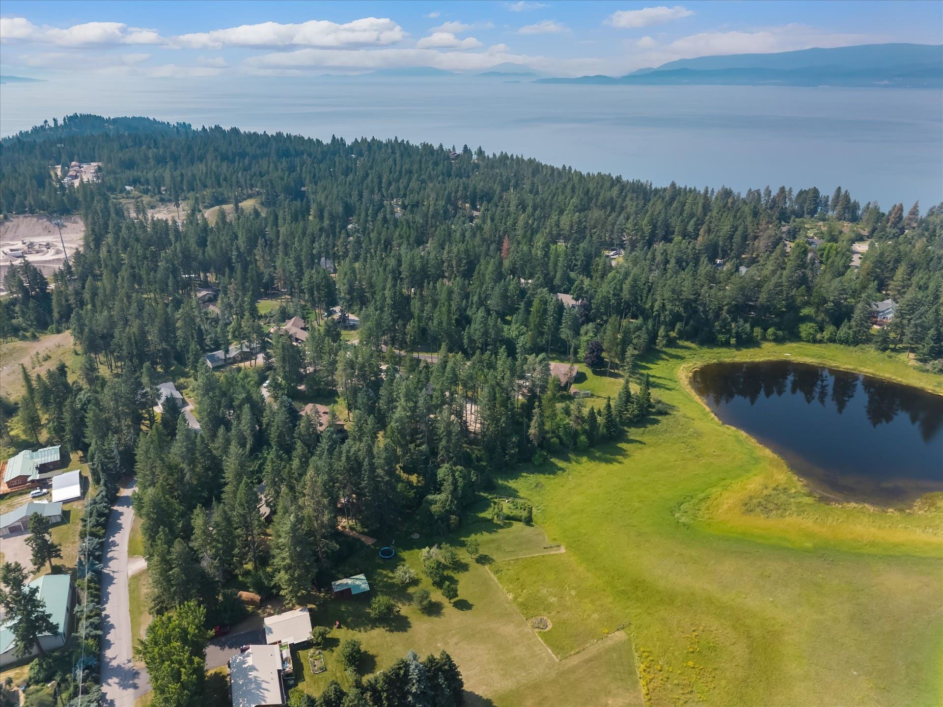 33542 Westview Drive, Bigfork, MT 59911 Elevated aerial shot highlighting Potato Lake bordering the back of the property