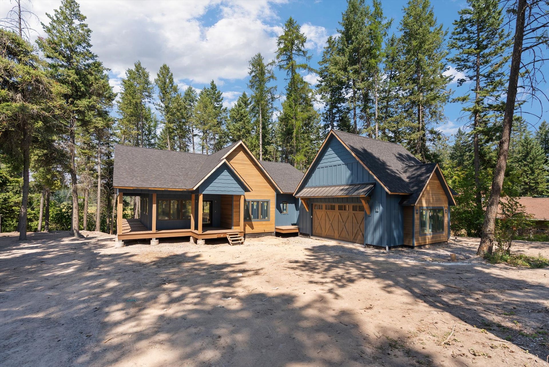 33542 Westview Drive, Bigfork, MT 59911 Front exterior featuring custom timber accents, Hardie Board siding, and garage door