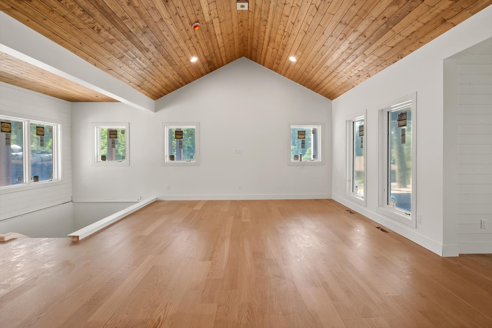 33542 Westview Drive, Bigfork, MT 59911 Vaulted great room framed by large windows and rich tongue-and-groove wood ceilings