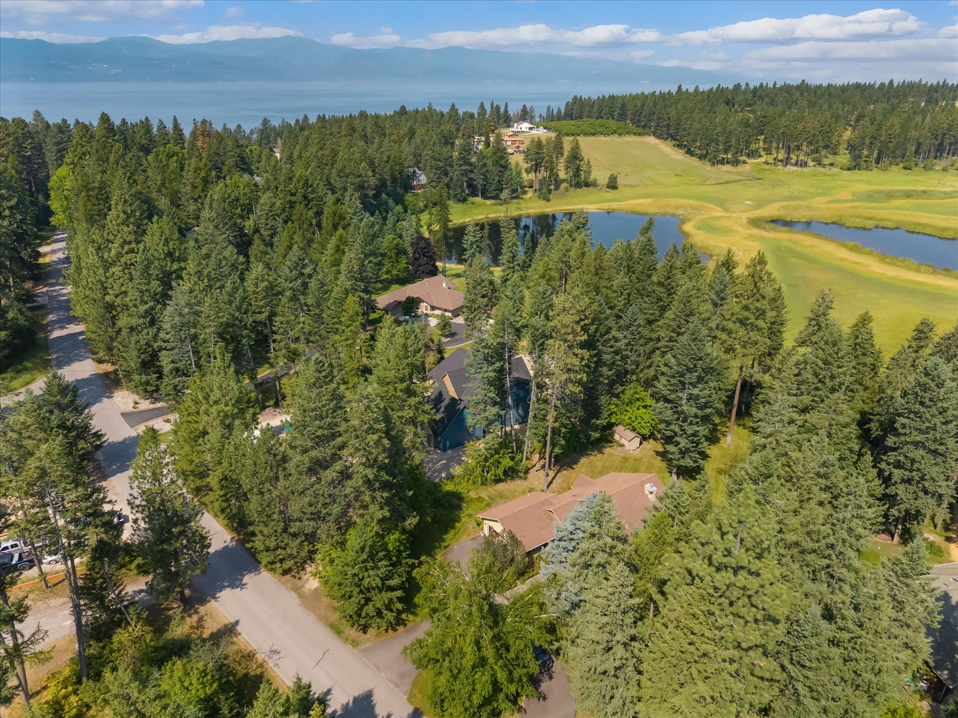33542 Westview Drive, Bigfork, MT 59911 Aerial shot of Westview Drive capturing the property's proximity to Potato Lake and Flathead Lake