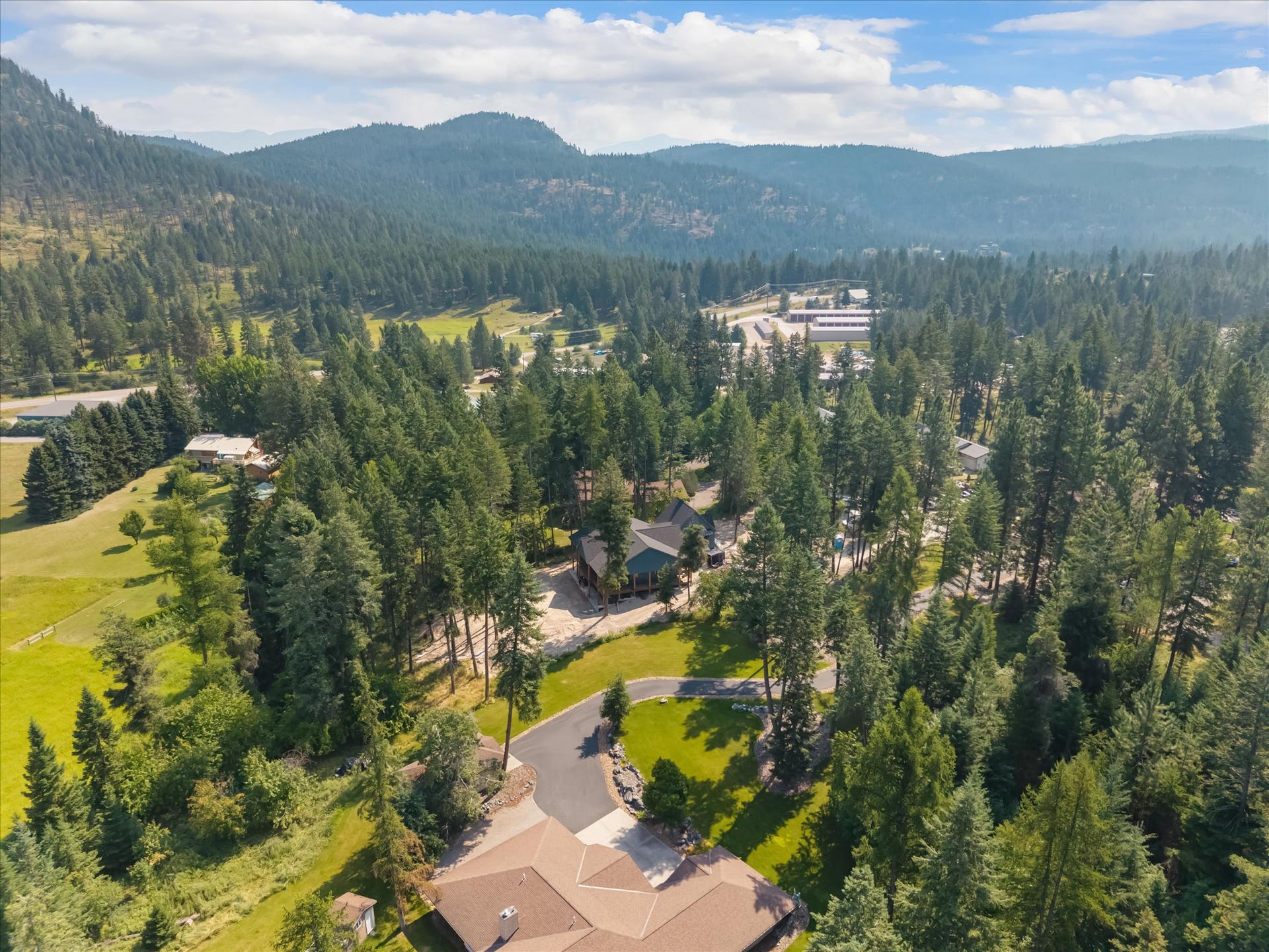 33542 Westview Drive, Bigfork, MT 59911 Aerial perspective of the home nestling into its private, treed setting in Sterling Estates