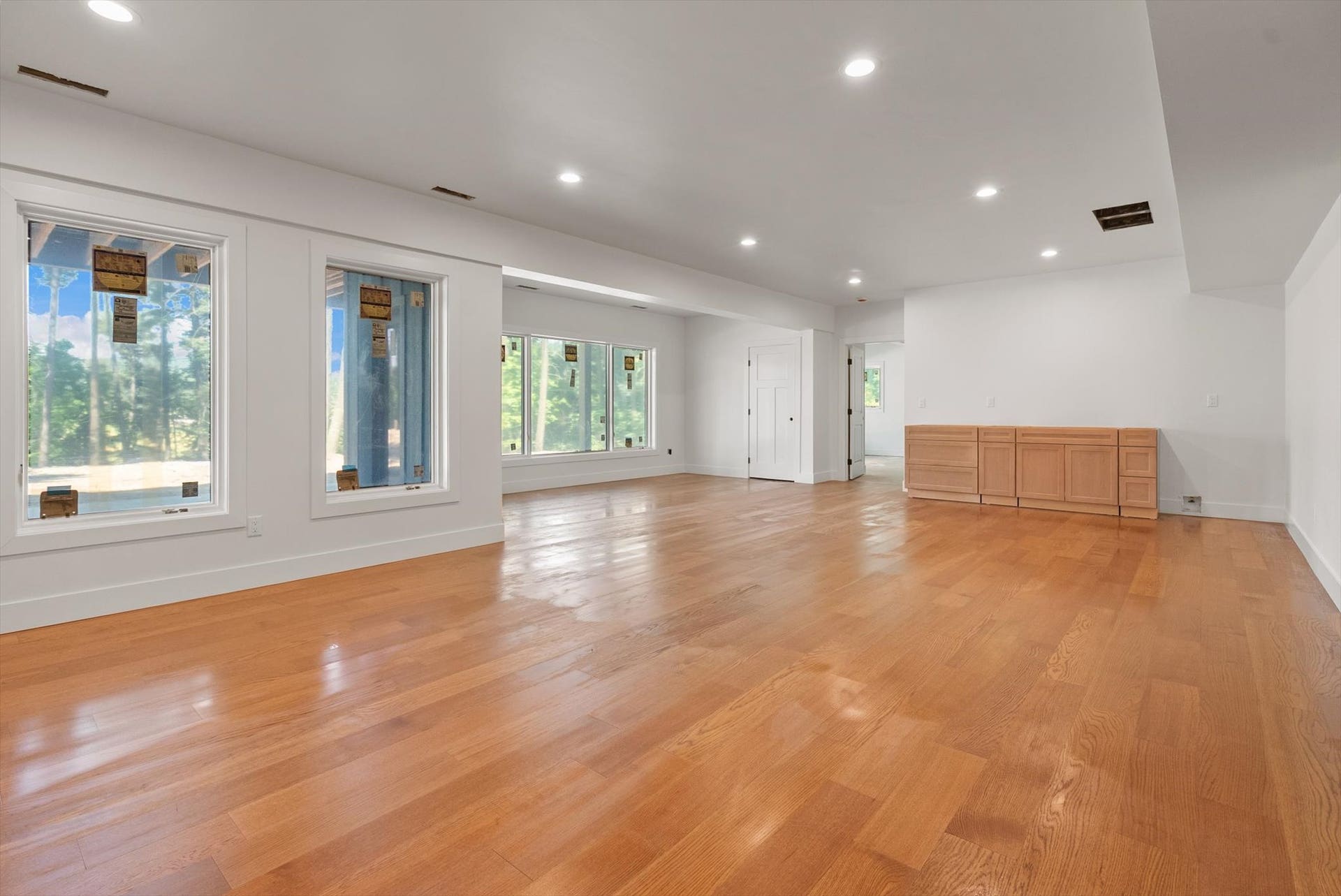 33542 Westview Drive, Bigfork, MT 59911 Expansive lower-level recreation room with luxury vinyl plank flooring and wet bar