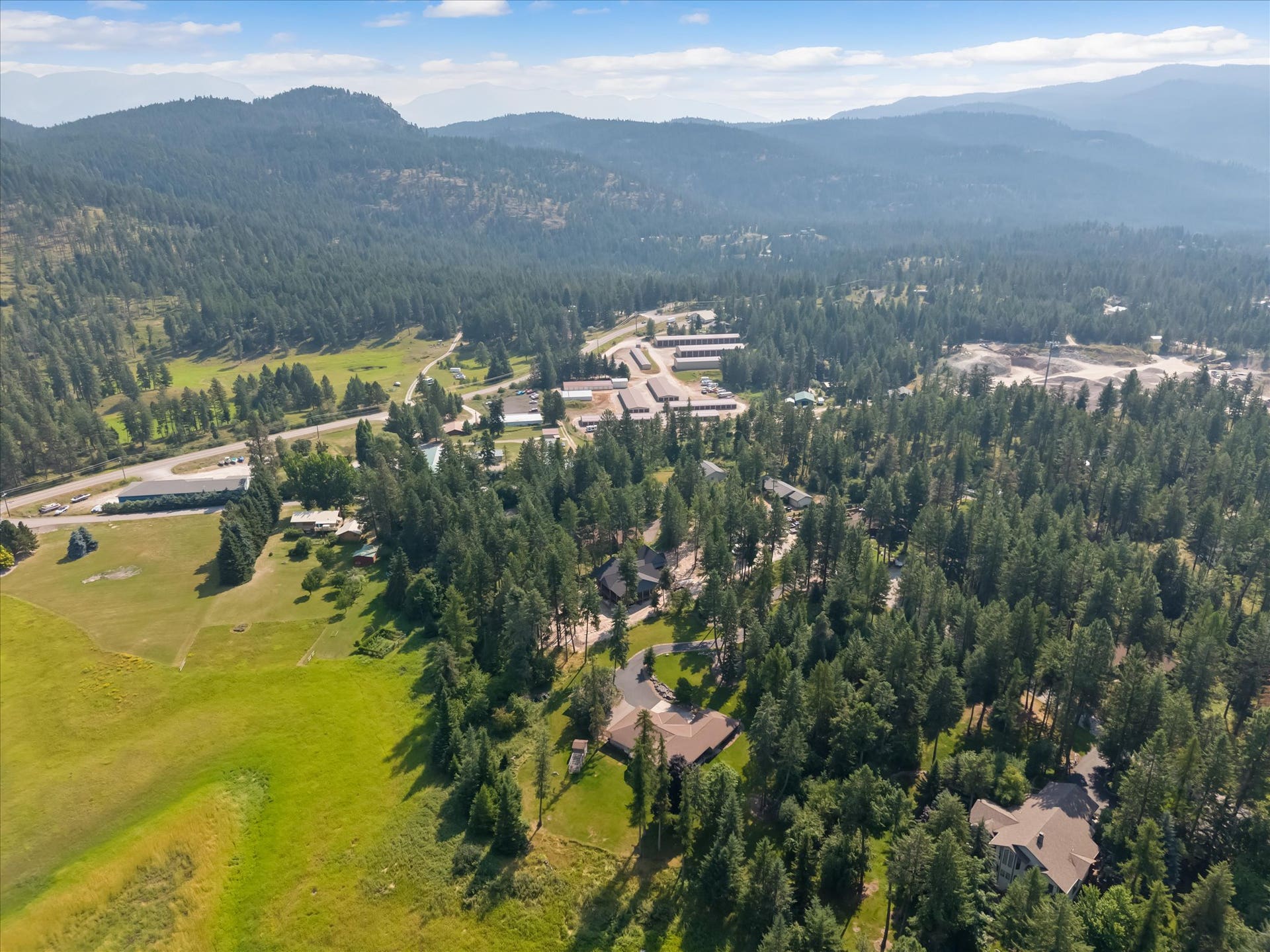 33542 Westview Drive, Bigfork, MT 59911 Aerial overview of the heavily timbered neighborhood and surrounding countryside