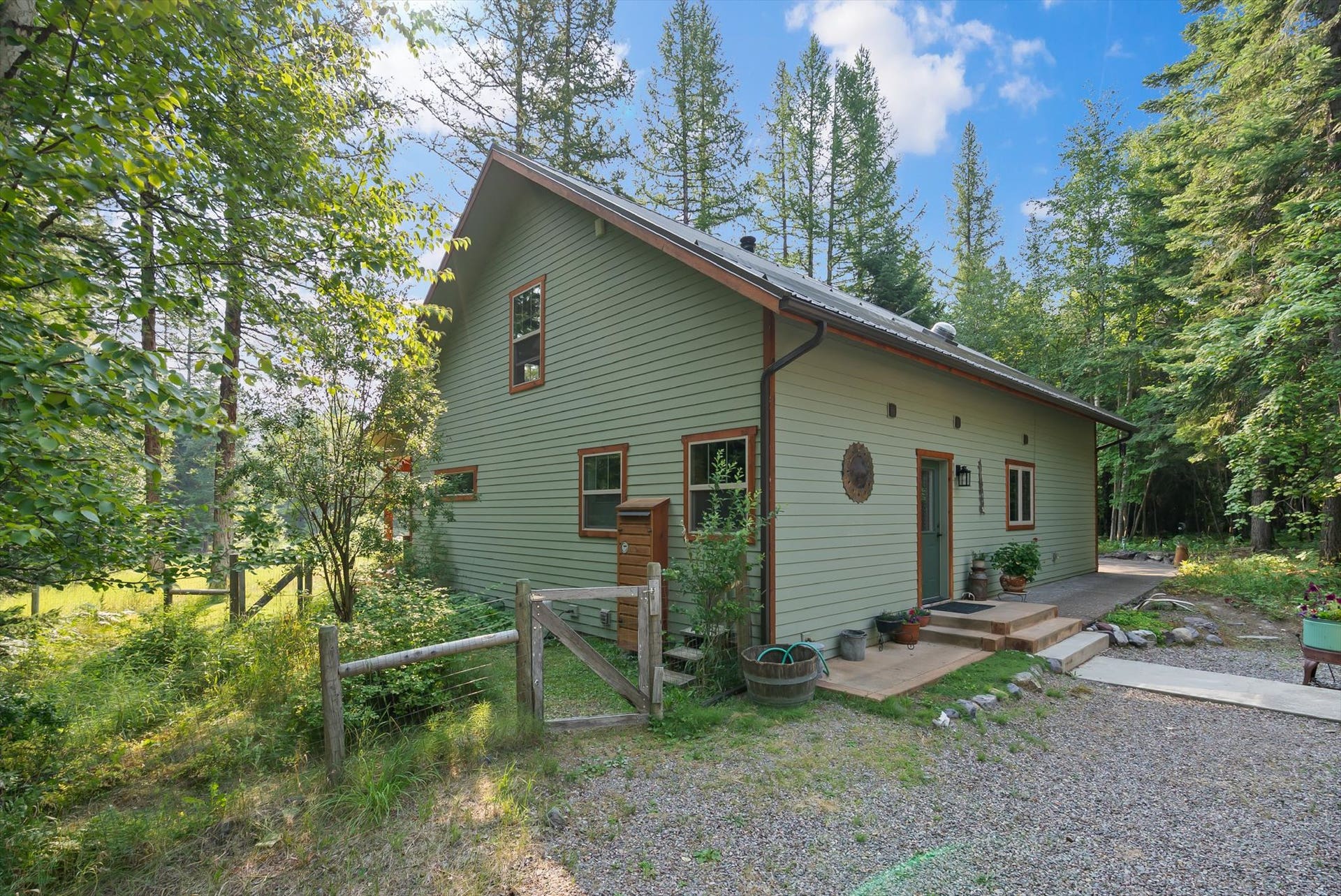 13786 Ridge Loop Road, Bigfork, MT 59911 Walkway to the detached garage and fenced dog yard