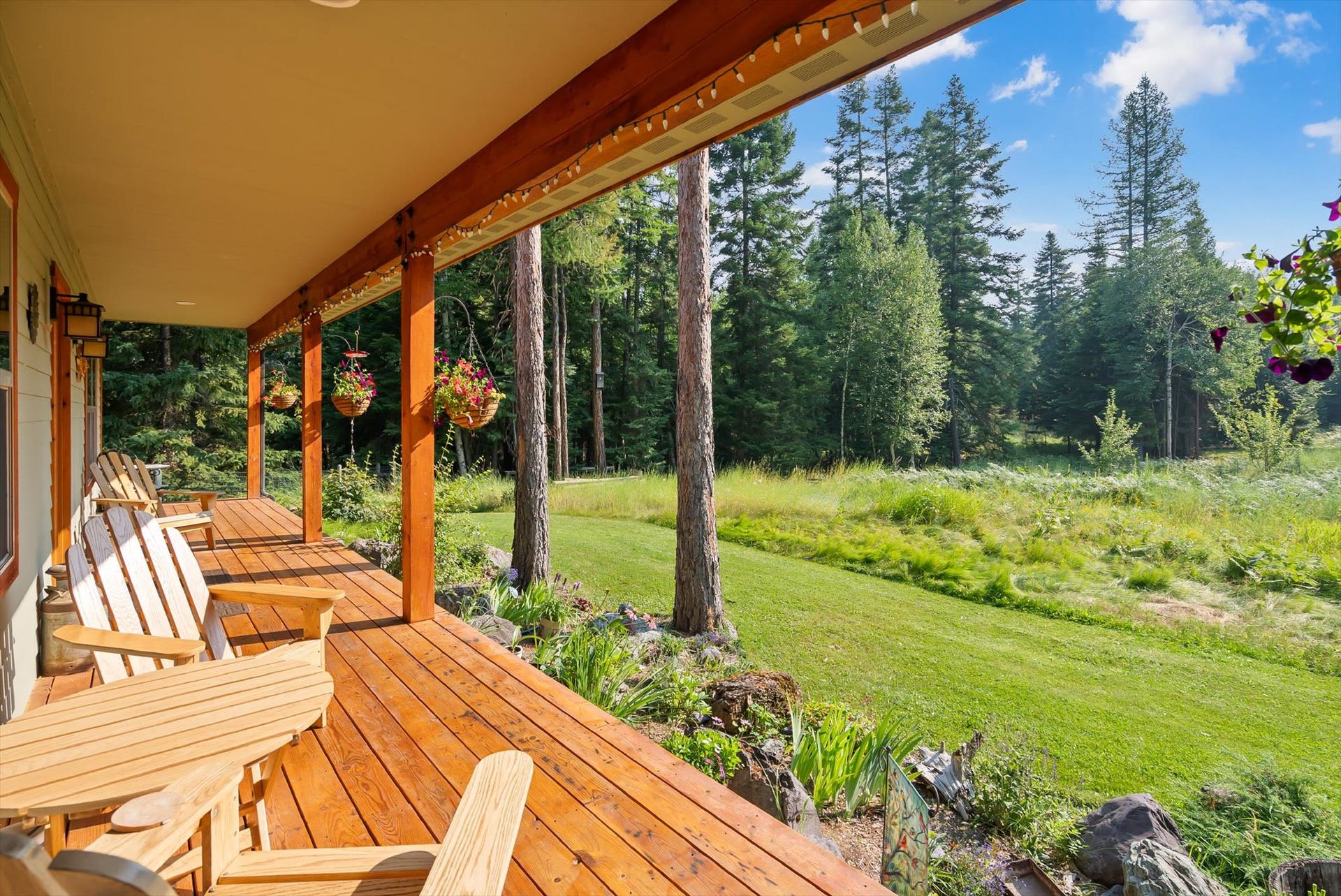 13786 Ridge Loop Road, Bigfork, MT 59911 Front porch w/ tree views and peekaboo Swan Range views
