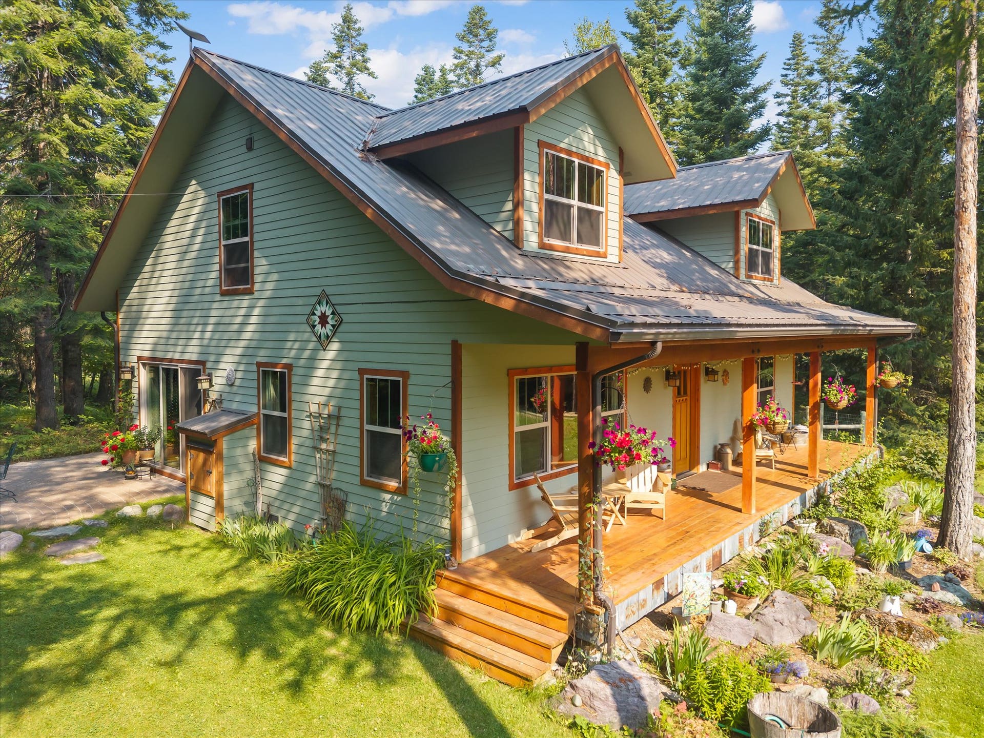 13786 Ridge Loop Road, Bigfork, MT 59911 Front covered porch, Side brick patio, Pass through firewood storage