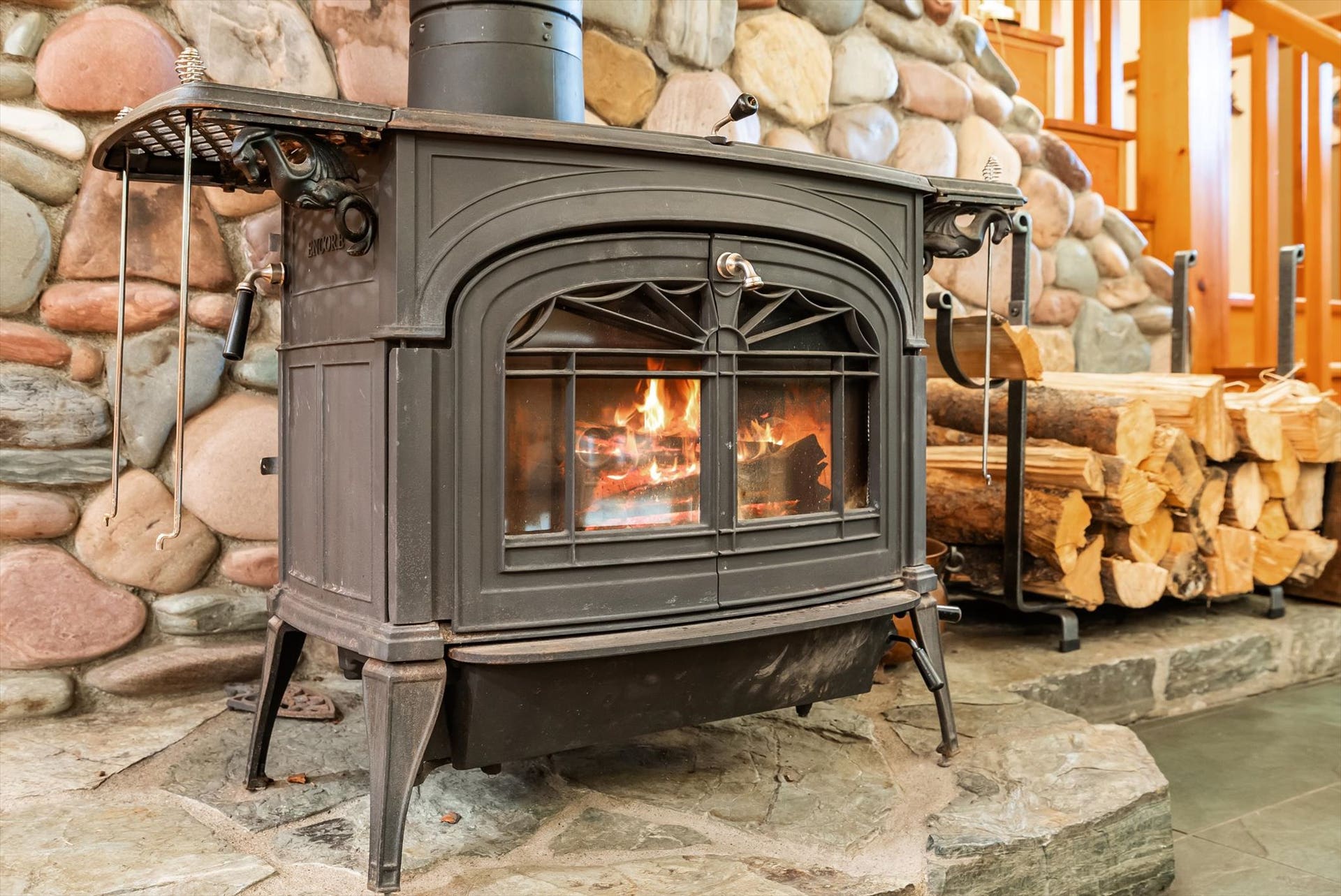 13786 Ridge Loop Road, Bigfork, MT 59911 Wood stove w/ custom stone hearth crafted from North Fork Flathead and Blackfoot River stones