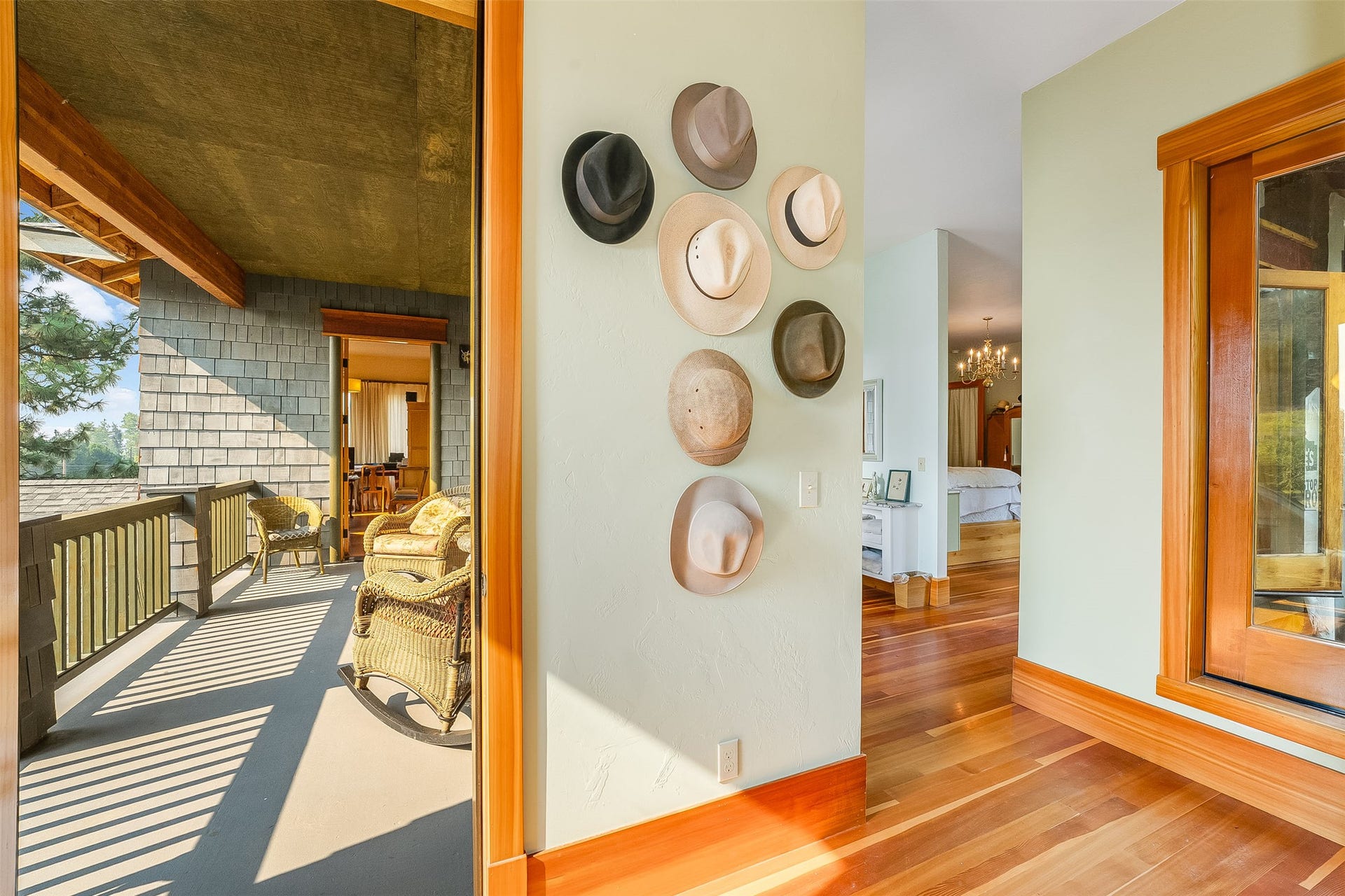 21848 Mt Highway 35, Bigfork, MT 59911 Hallway with access to the covered balcony between the two primary bedrooms.