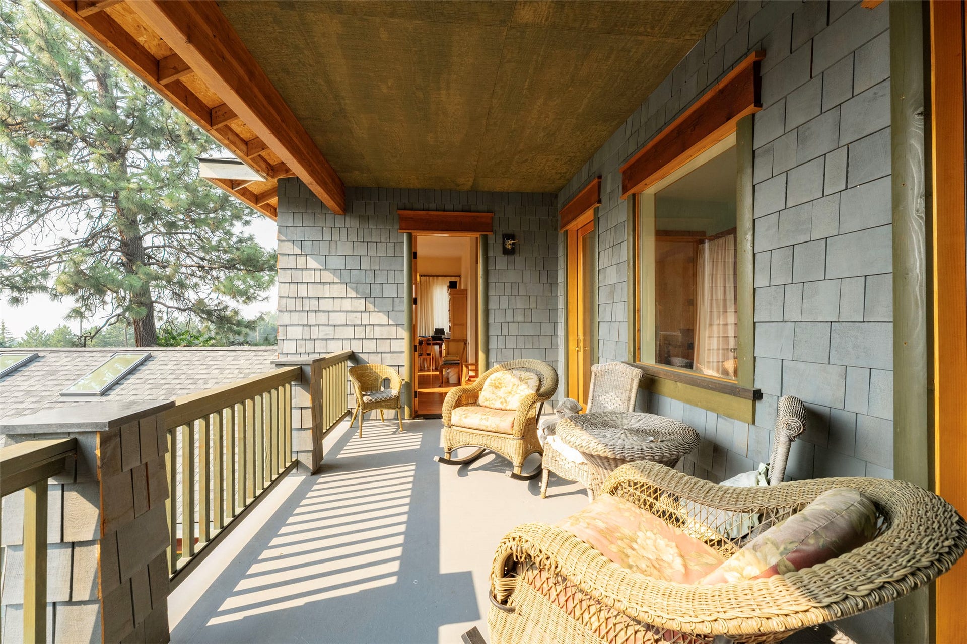 21848 Mt Highway 35, Bigfork, MT 59911 Covered balcony faces the sunsets for spectacular views of Flathead Lake.