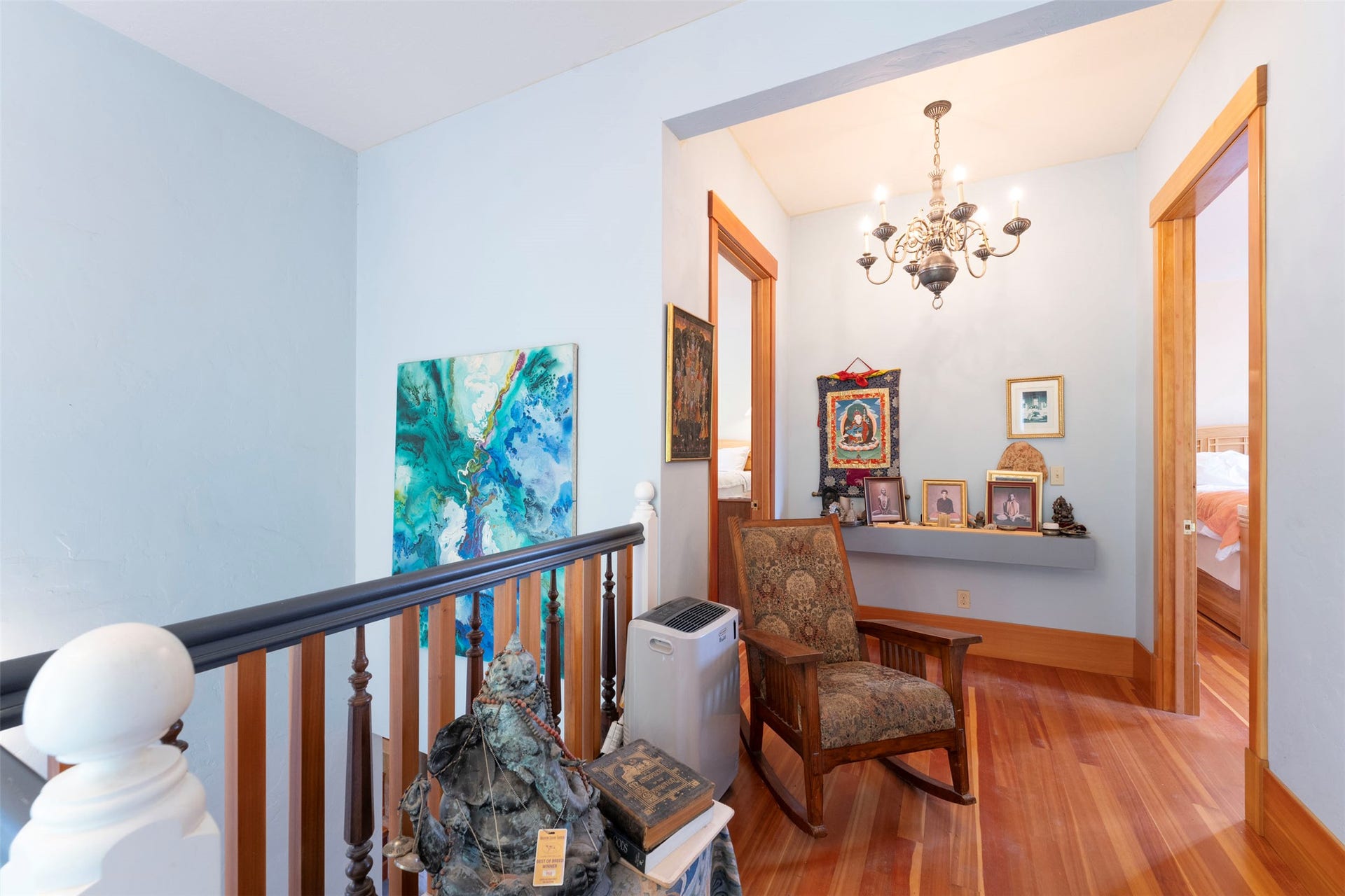 21848 Mt Highway 35, Bigfork, MT 59911 Landing at top of staircase hallway between two Primary Bedroom suites.