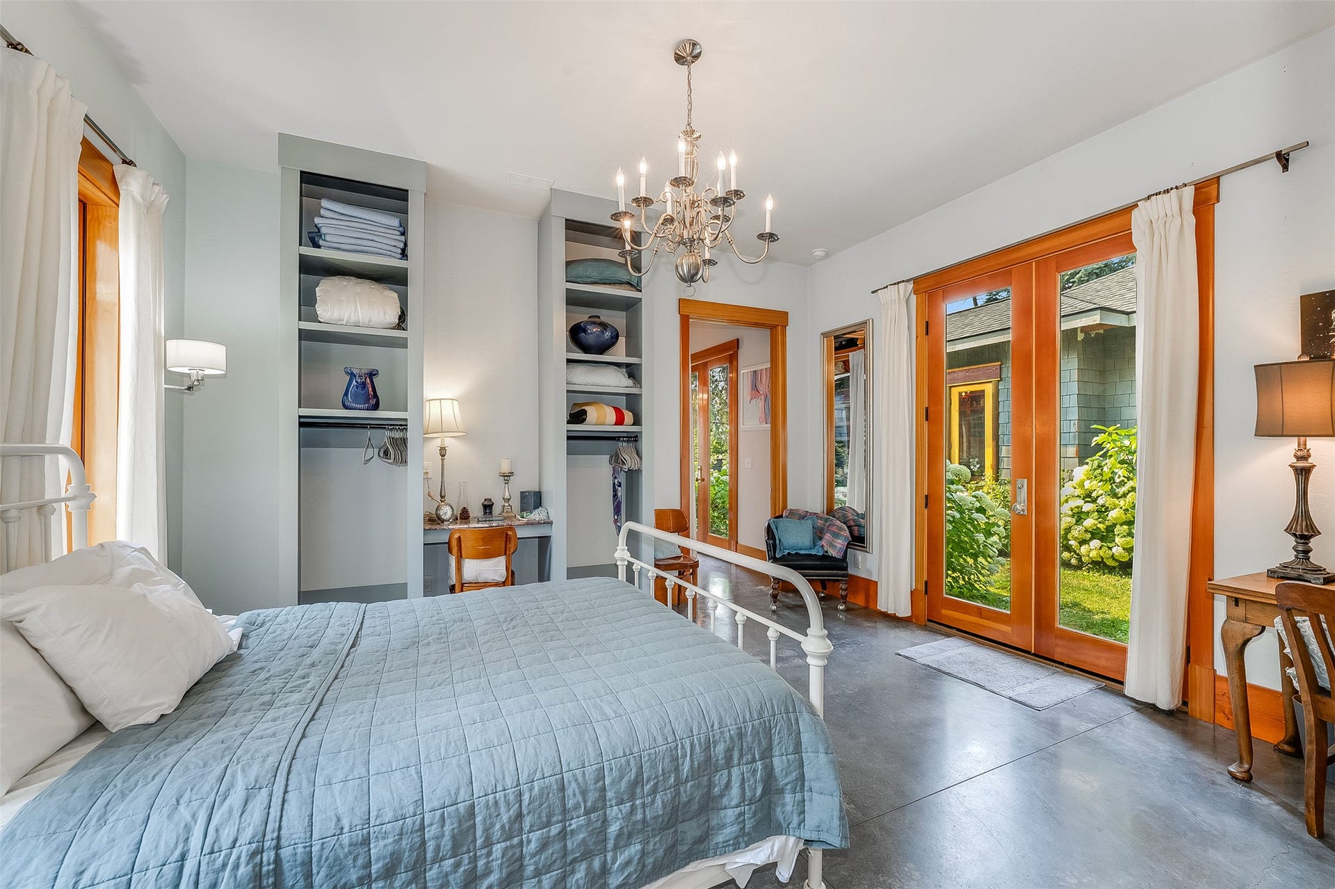 21848 Mt Highway 35, Bigfork, MT 59911 Polished concrete flooring complementing solid wood-frame French doors opening to the central courtyard