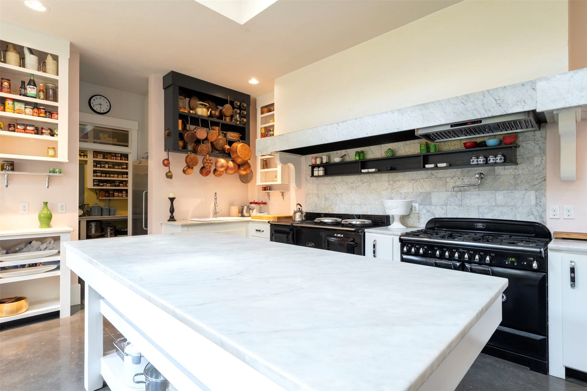 21848 Mt Highway 35, Bigfork, MT 59911 Carrara marble island work table in center of the kitchen.