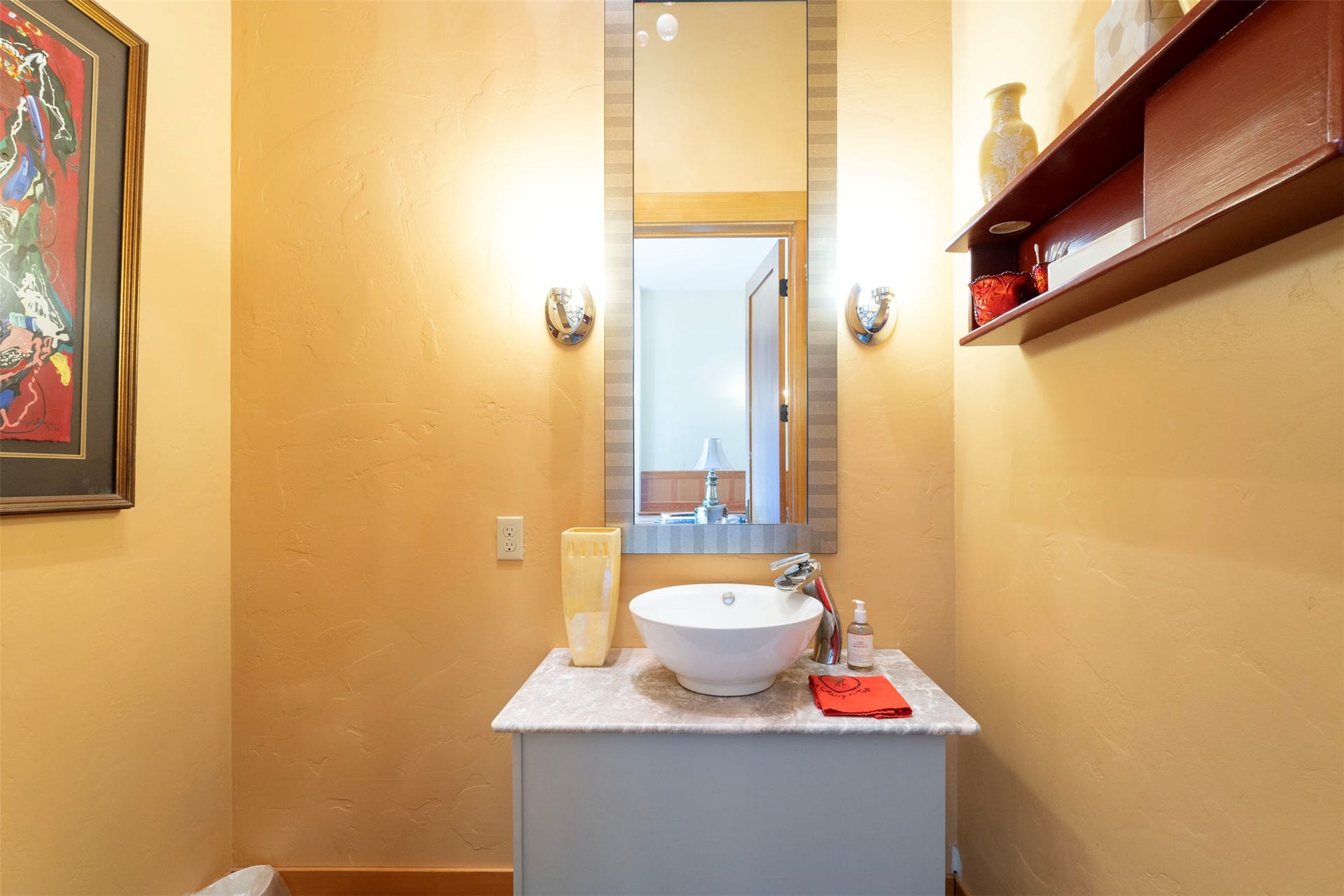 21848 Mt Highway 35, Bigfork, MT 59911 Vanity featuring a vessel sink, single-handle faucet, and stone-finish countertop