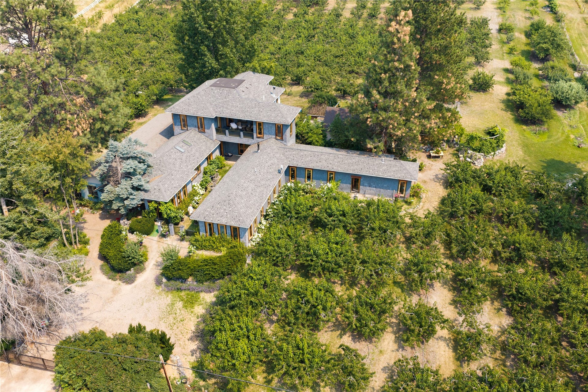 21848 Mt Highway 35, Bigfork, MT 59911 Expansive property featuring a multi-wing courtyard residence with a two-story section and center courtyard.
European influenced, authentic Montana home!