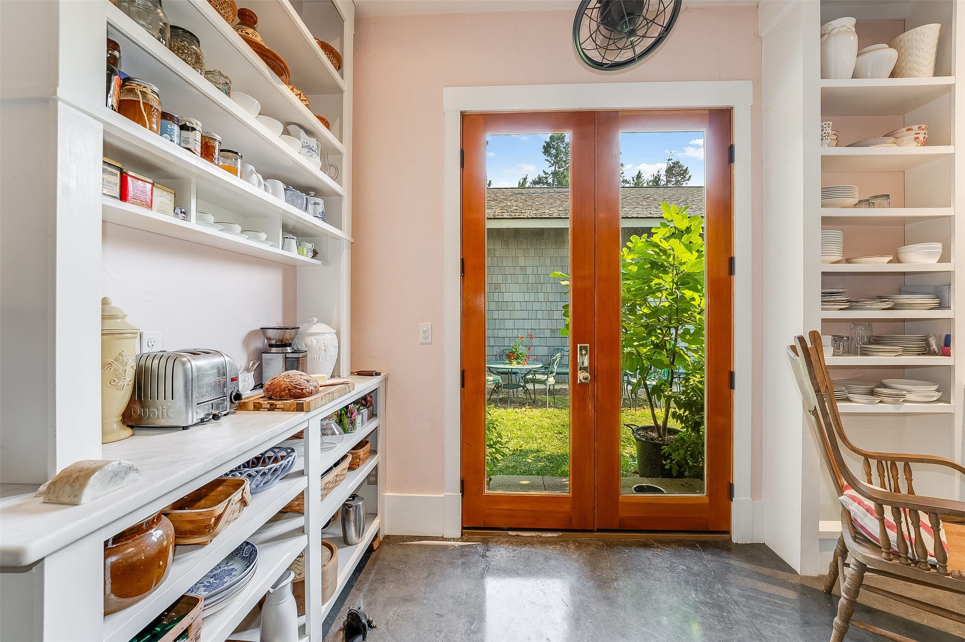 21848 Mt Highway 35, Bigfork, MT 59911 Built in shelves for dishes, serving area and toast and jam bar.
Door to center courtyard
