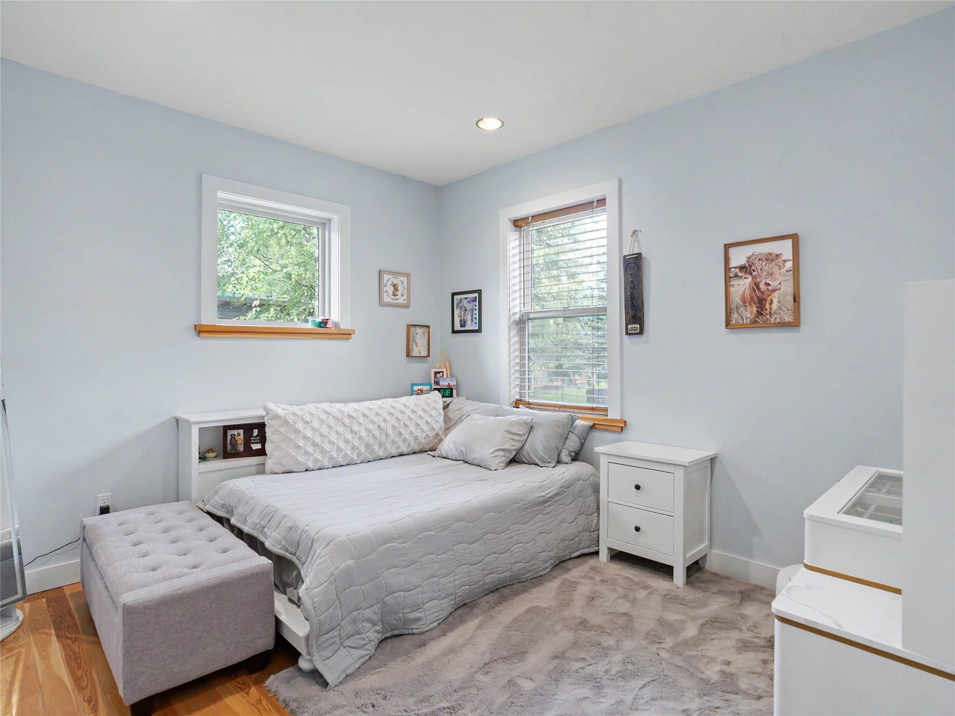 28012 Meadow Creek Road, Bigfork, MT 59911 2nd bedroom featuring two windows with white trim and natural wood sills