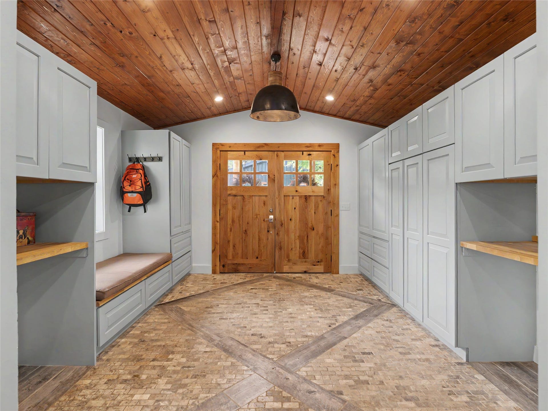 28012 Meadow Creek Road, Bigfork, MT 59911 Beautiful tiled entrance with seating and storage areas