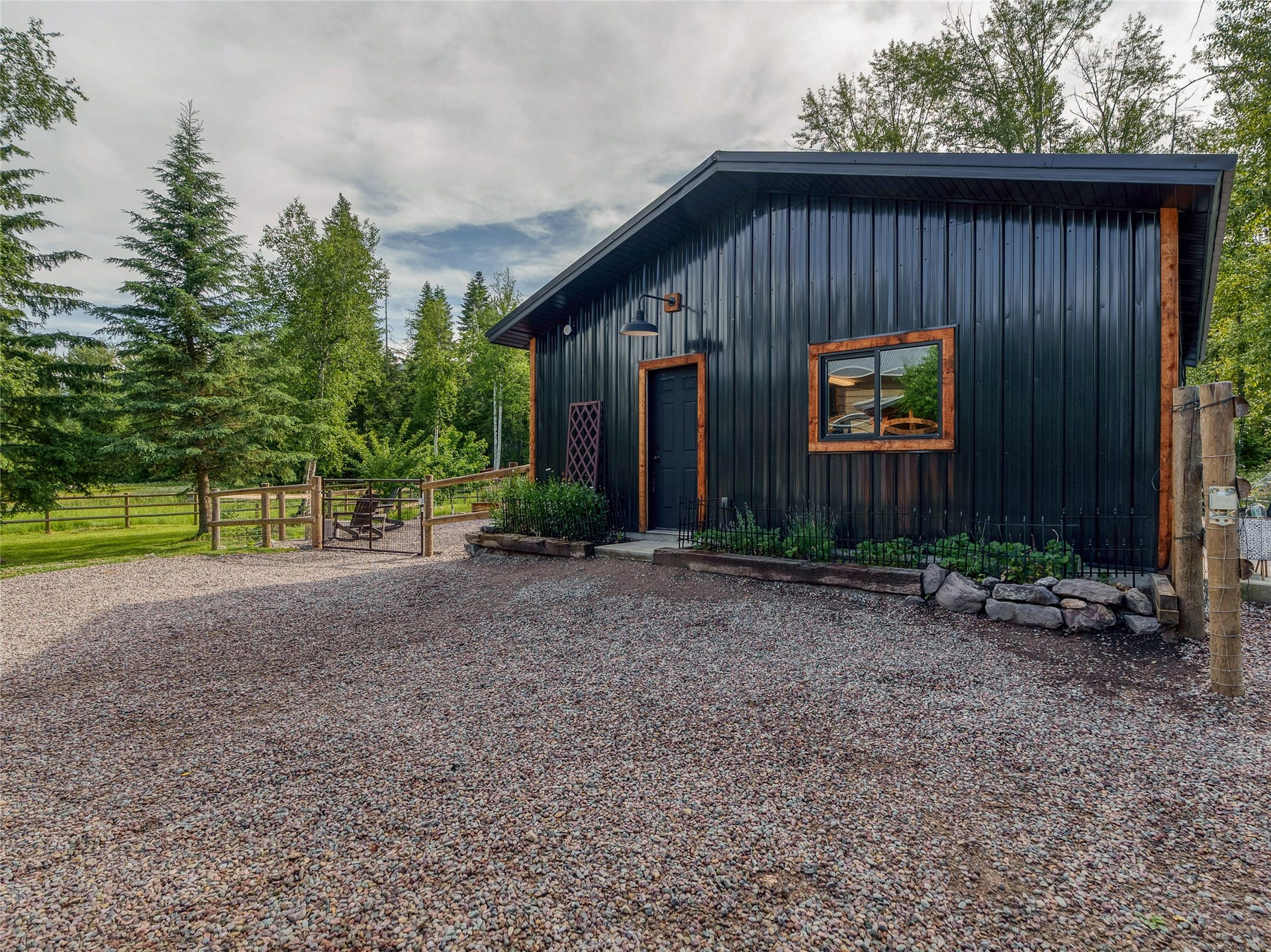 28012 Meadow Creek Road, Bigfork, MT 59911 Entry to guest quarters and three car garage