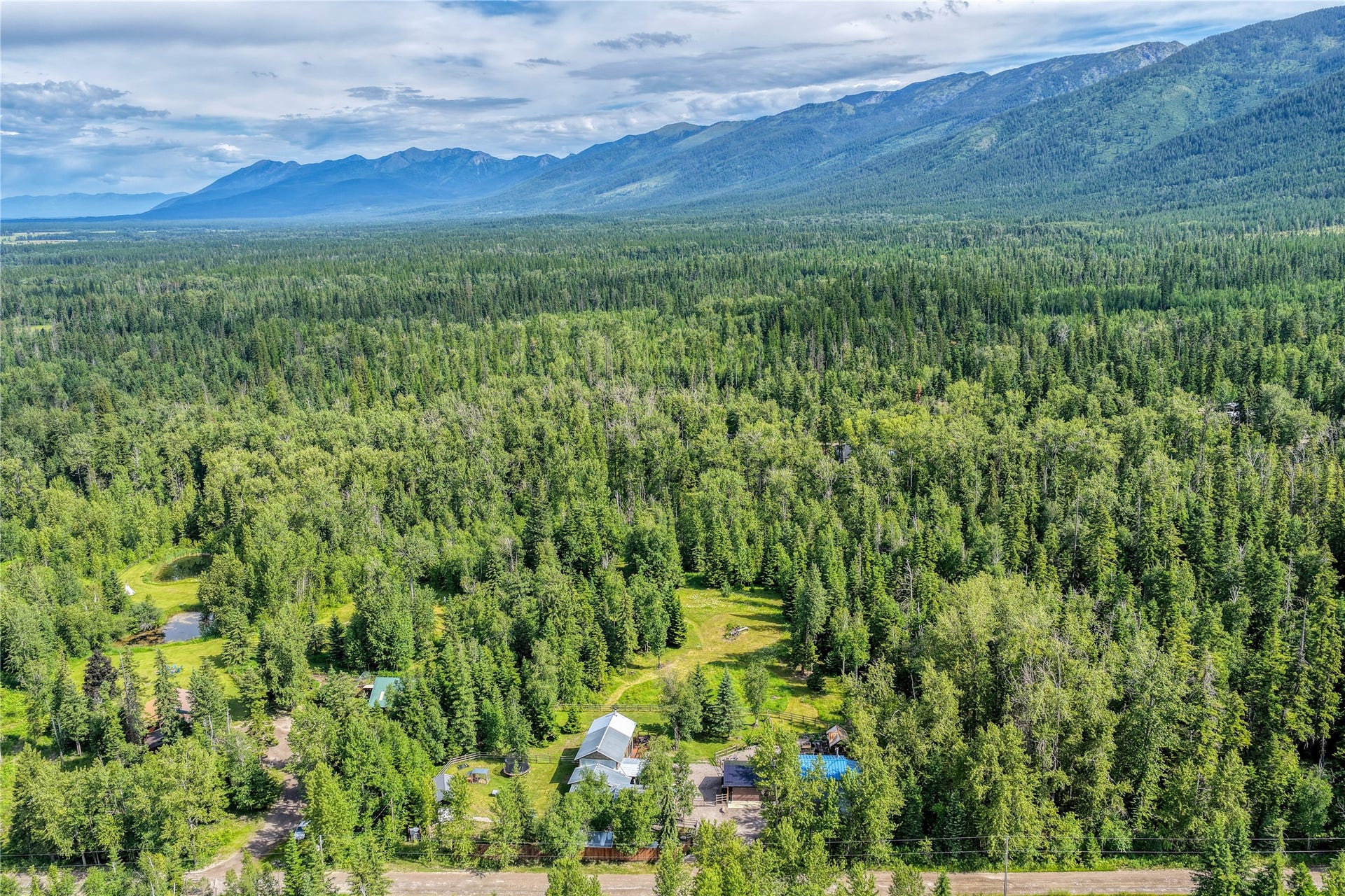28012 Meadow Creek Road, Bigfork, MT 59911 Expansive forested landscape with mountain backdrop