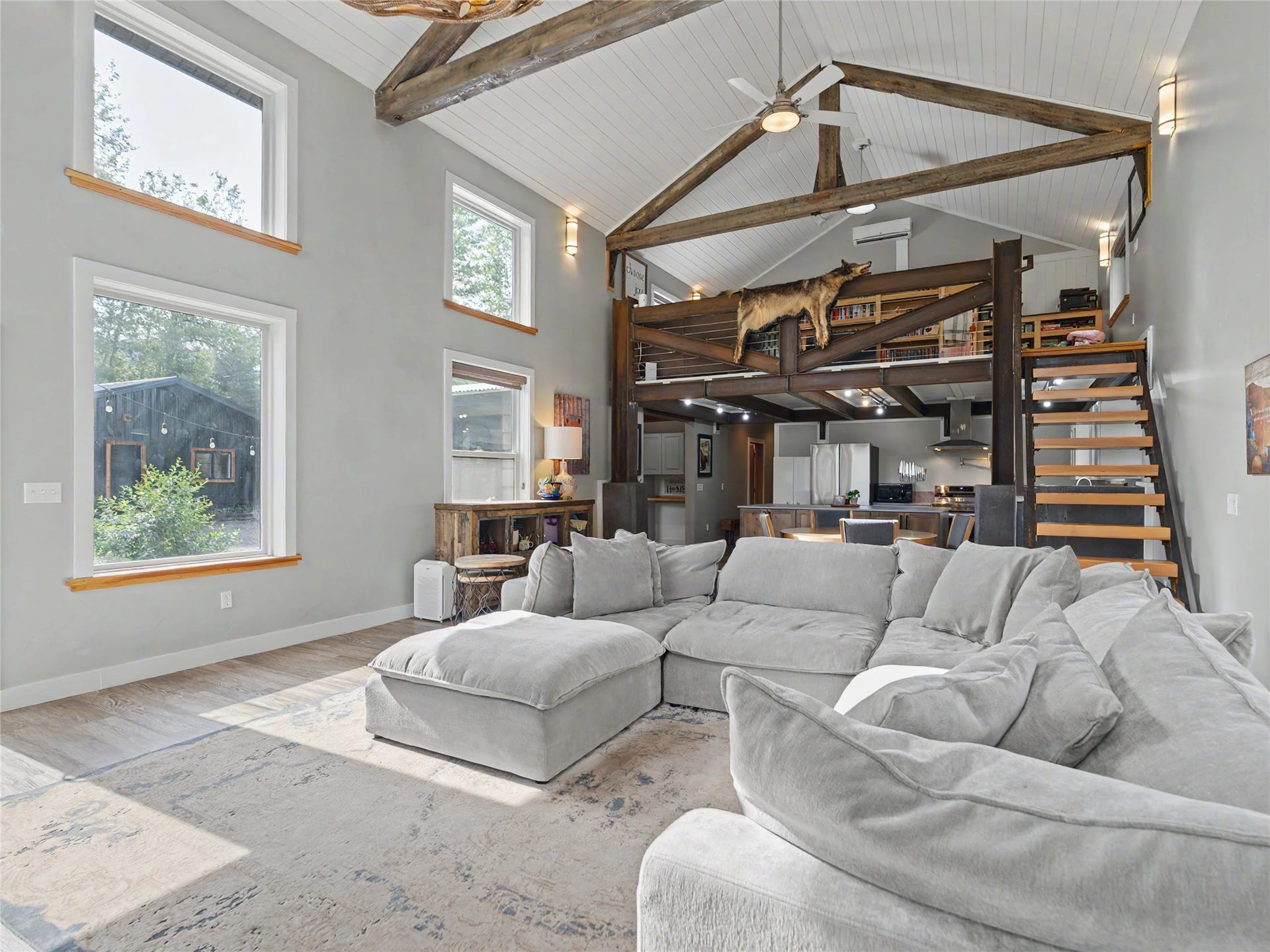 28012 Meadow Creek Road, Bigfork, MT 59911 Vaulted ceiling featuring exposed wood beams and white tongue-and-groove paneling