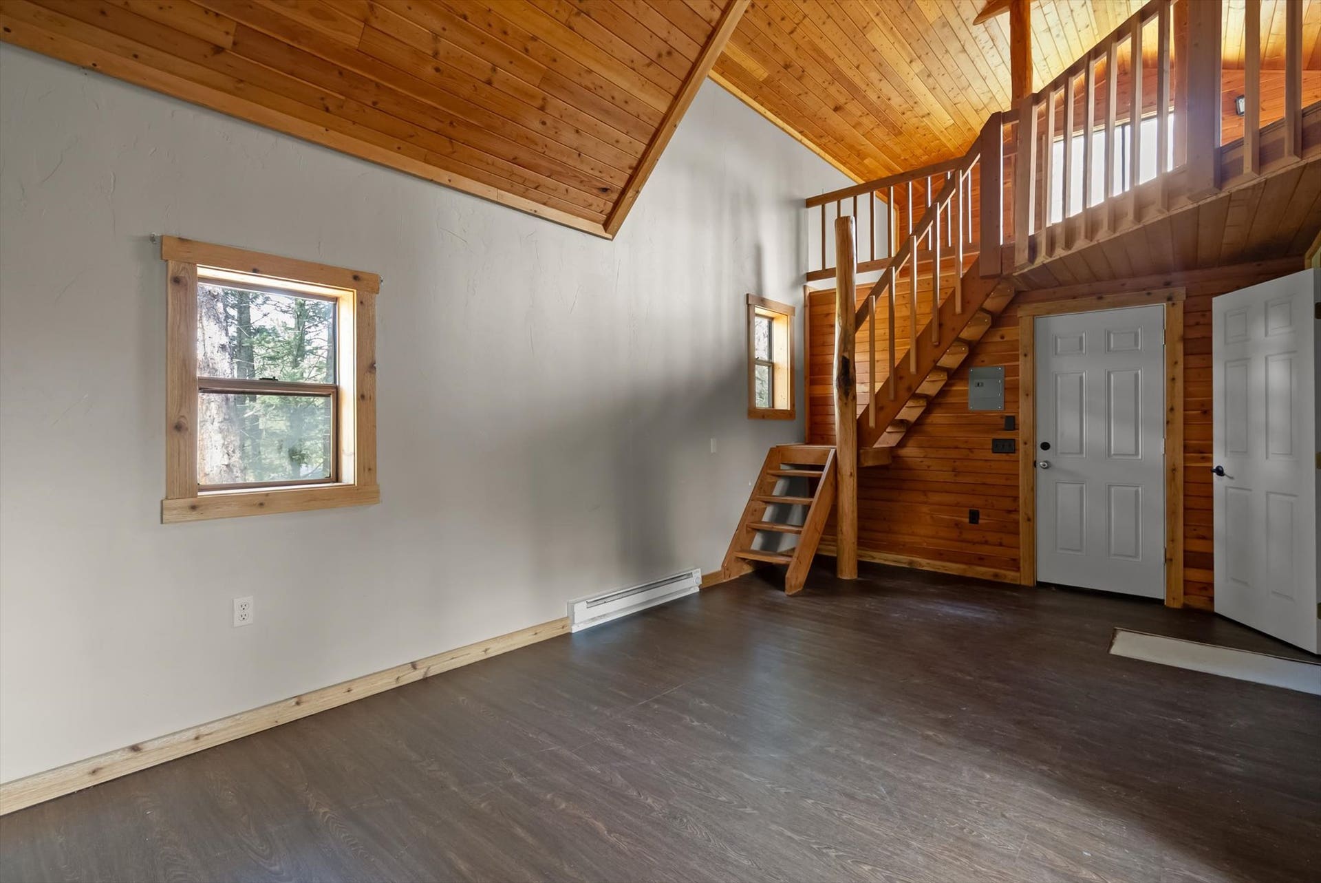 300 Peaceful Drive, Bigfork, MT 59911 Vaulted wood-paneled ceiling with dark wood-finish flooring