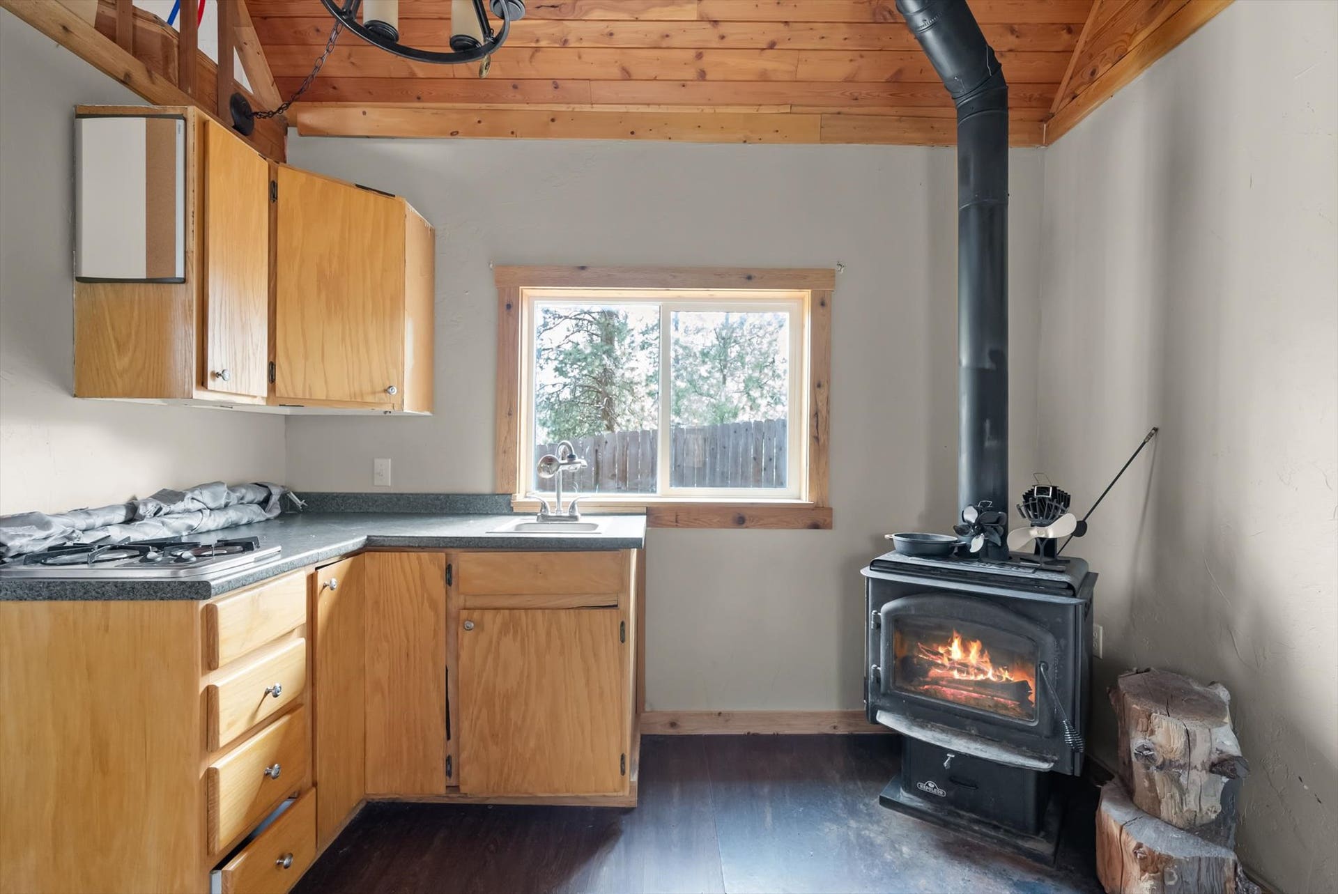 300 Peaceful Drive, Bigfork, MT 59911 Wood-finish ceiling beams with an industrial-style chandelier