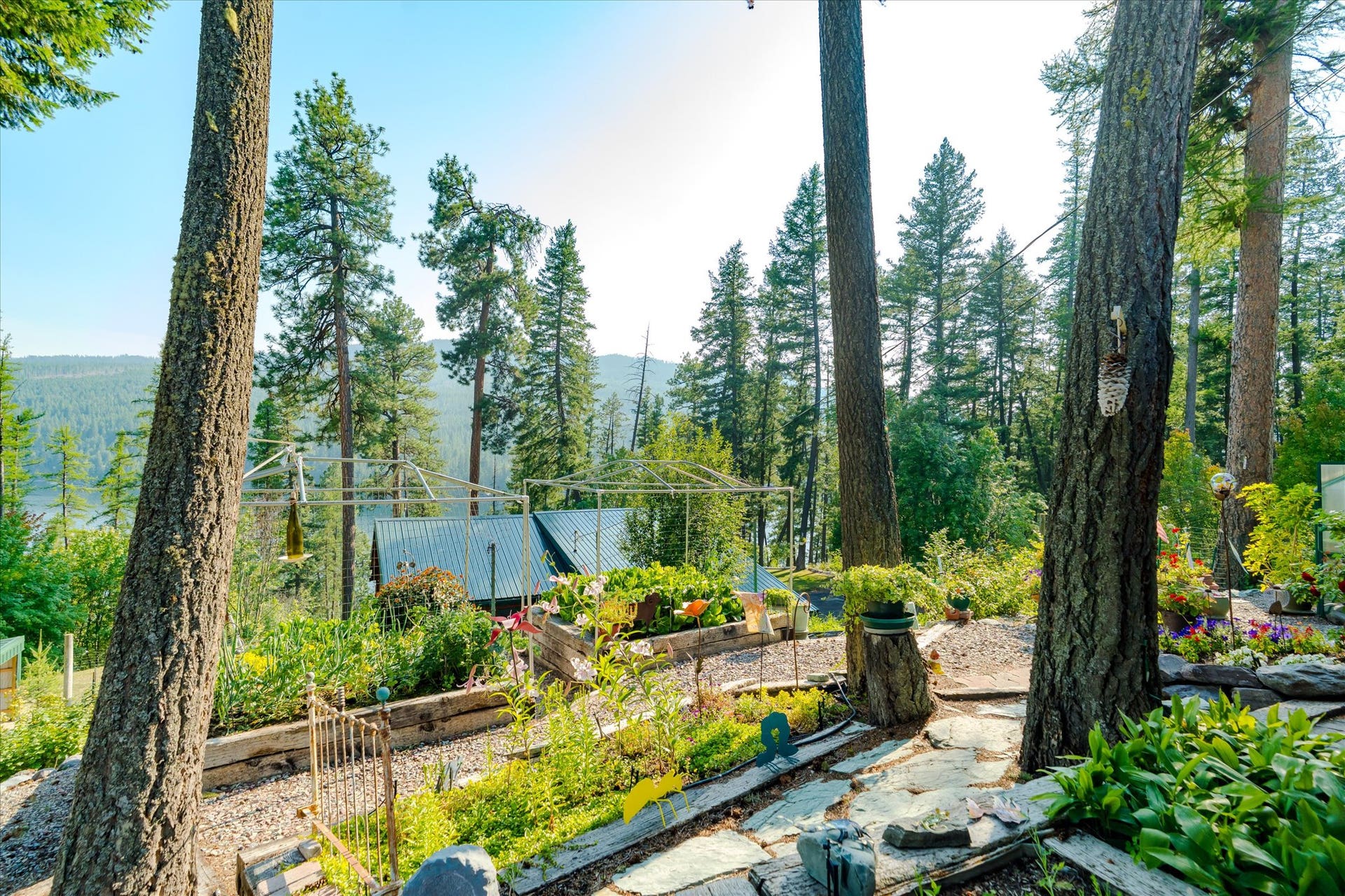 14259 Sunburst Drive, Bigfork, MT 59911 view from garden to the house and lake
