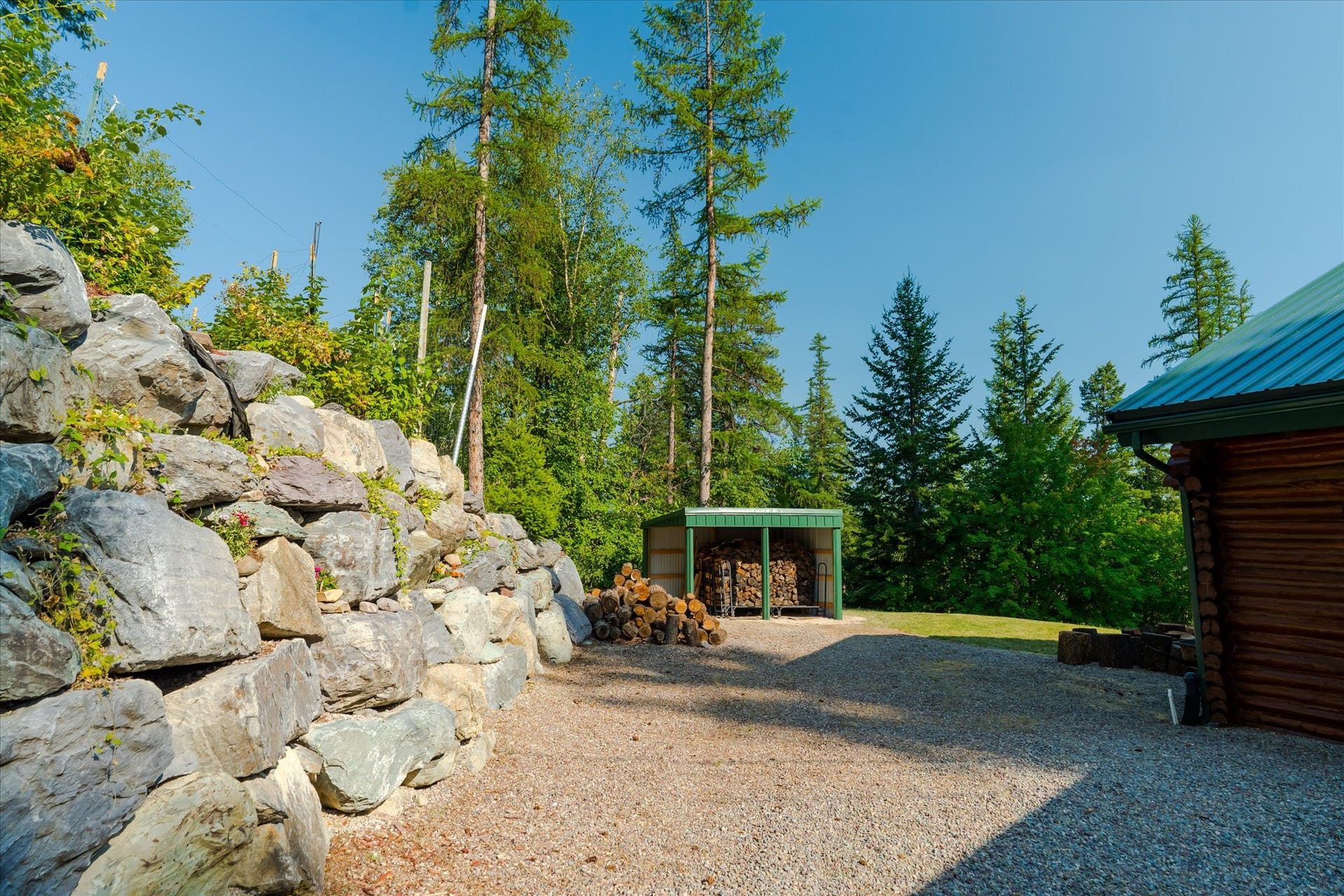 14259 Sunburst Drive, Bigfork, MT 59911 back yard - view of wood shed