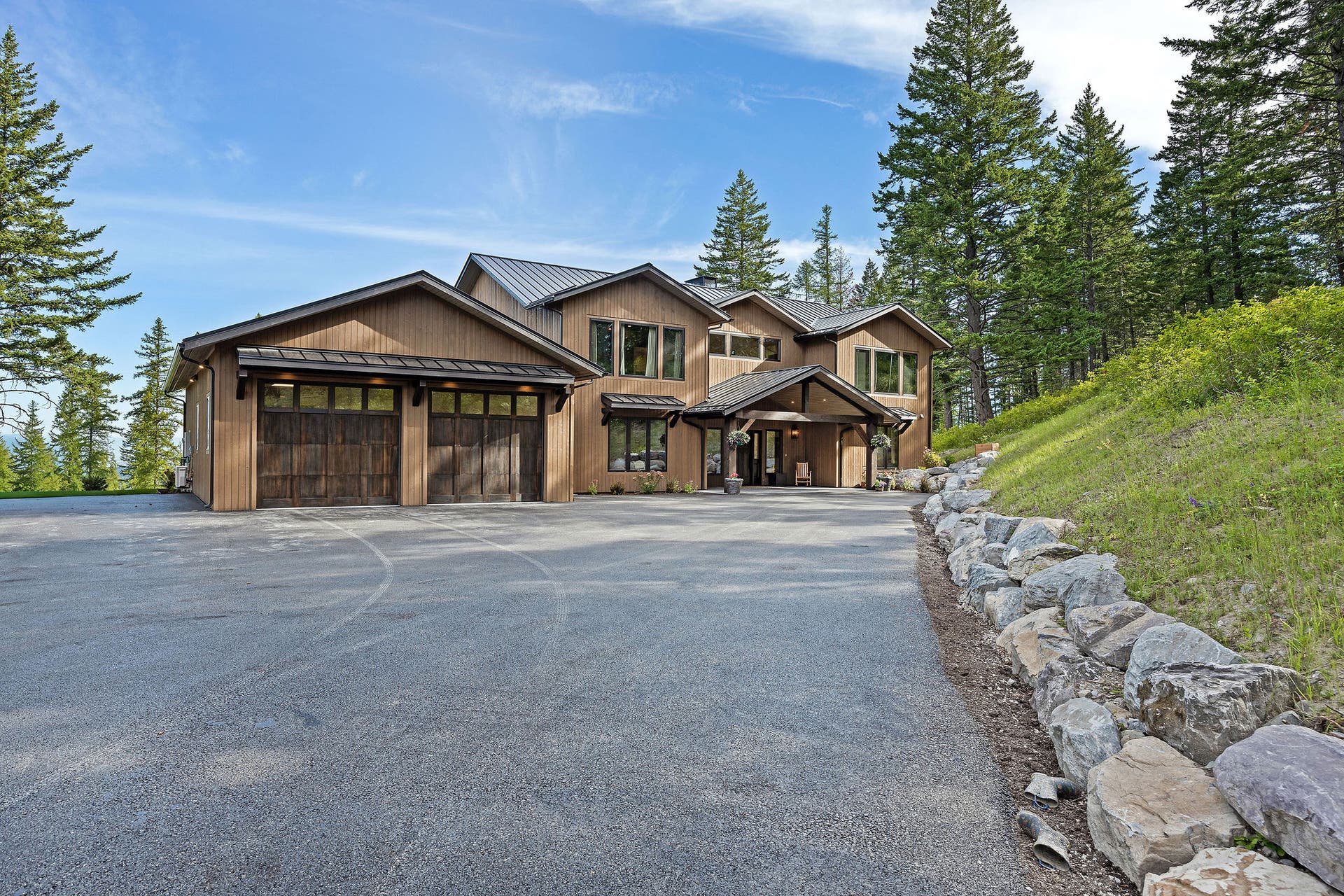 205 Pinto Trail, Bigfork, MT 59911 Rustic modern architectural style with natural wood siding and a metal roof