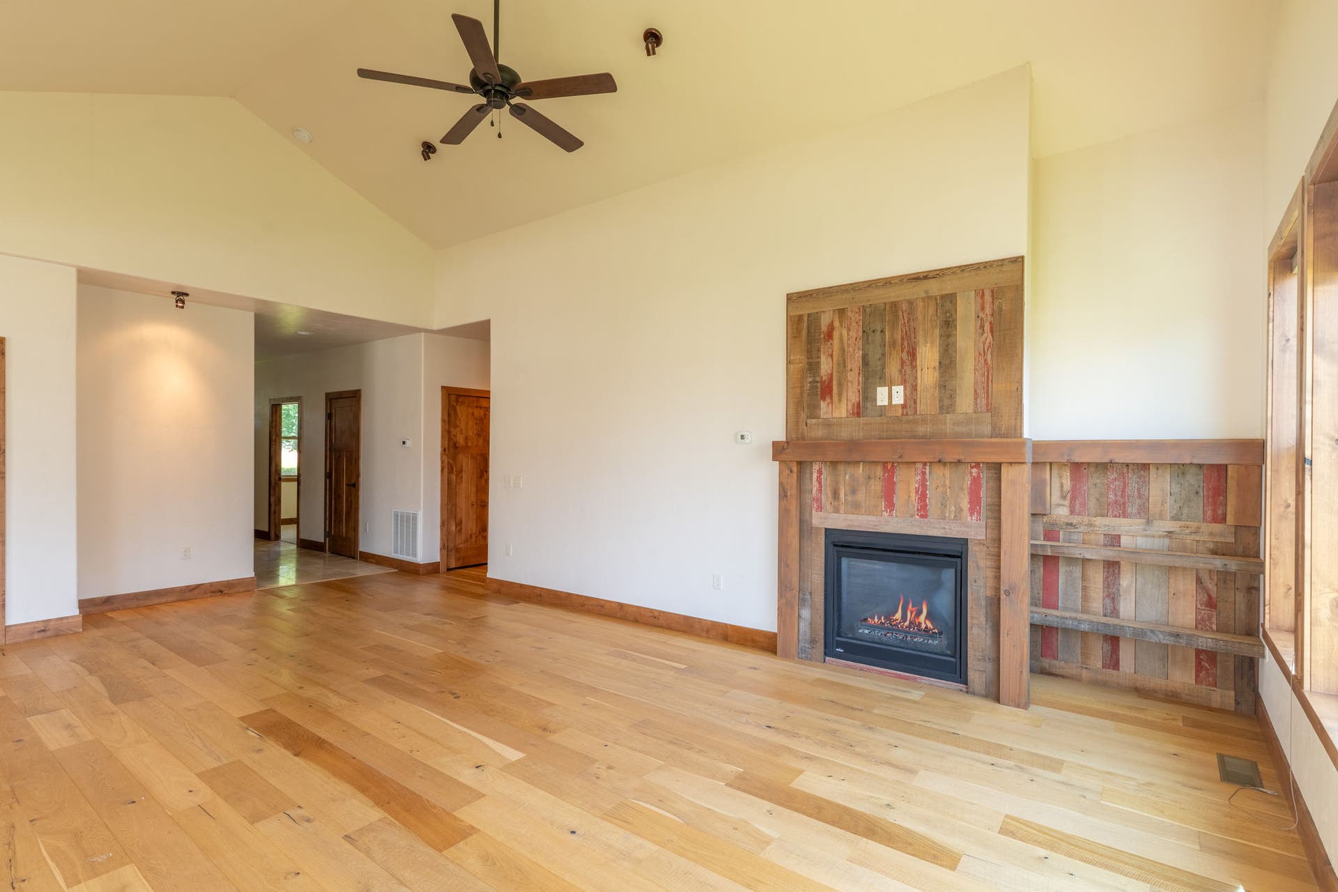 204 Bluebunch Court, Bigfork, MT 59911 Cozy fireplace with barn wood detailing